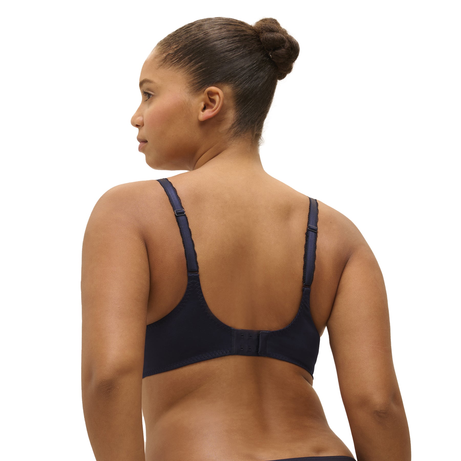 Back view of navy lace bra with smooth band and hook-and-eye closure