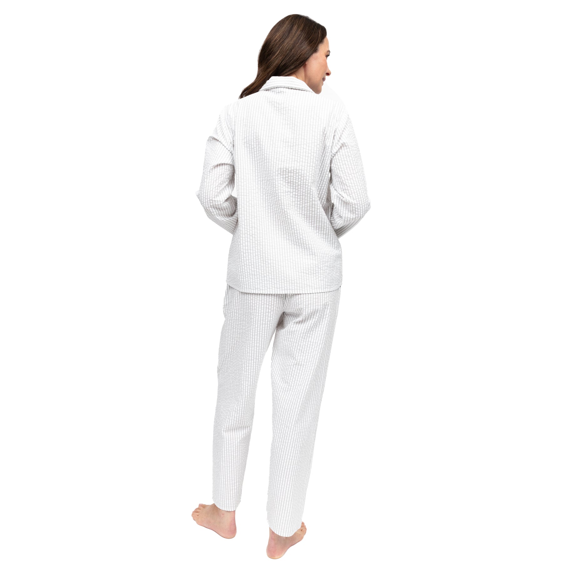Back view of women’s light grey and white striped cotton pyjama set showing relaxed fit and straight-leg silhouette.