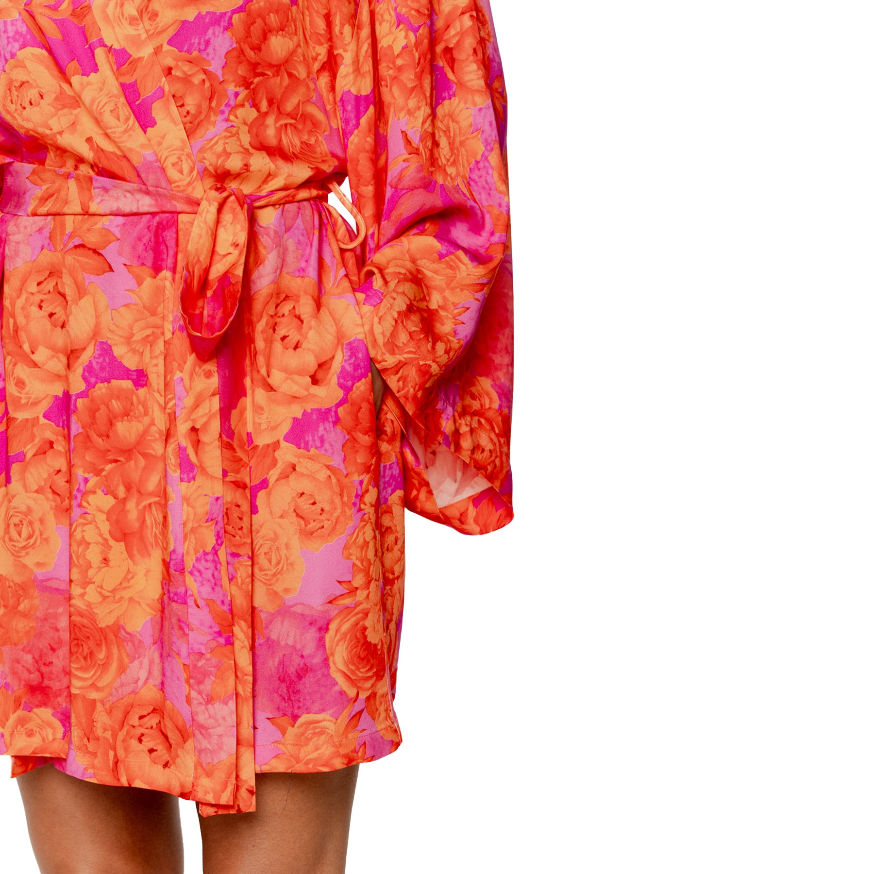 Floral robe with vibrant pink and orange print, close-up of waist tie detail