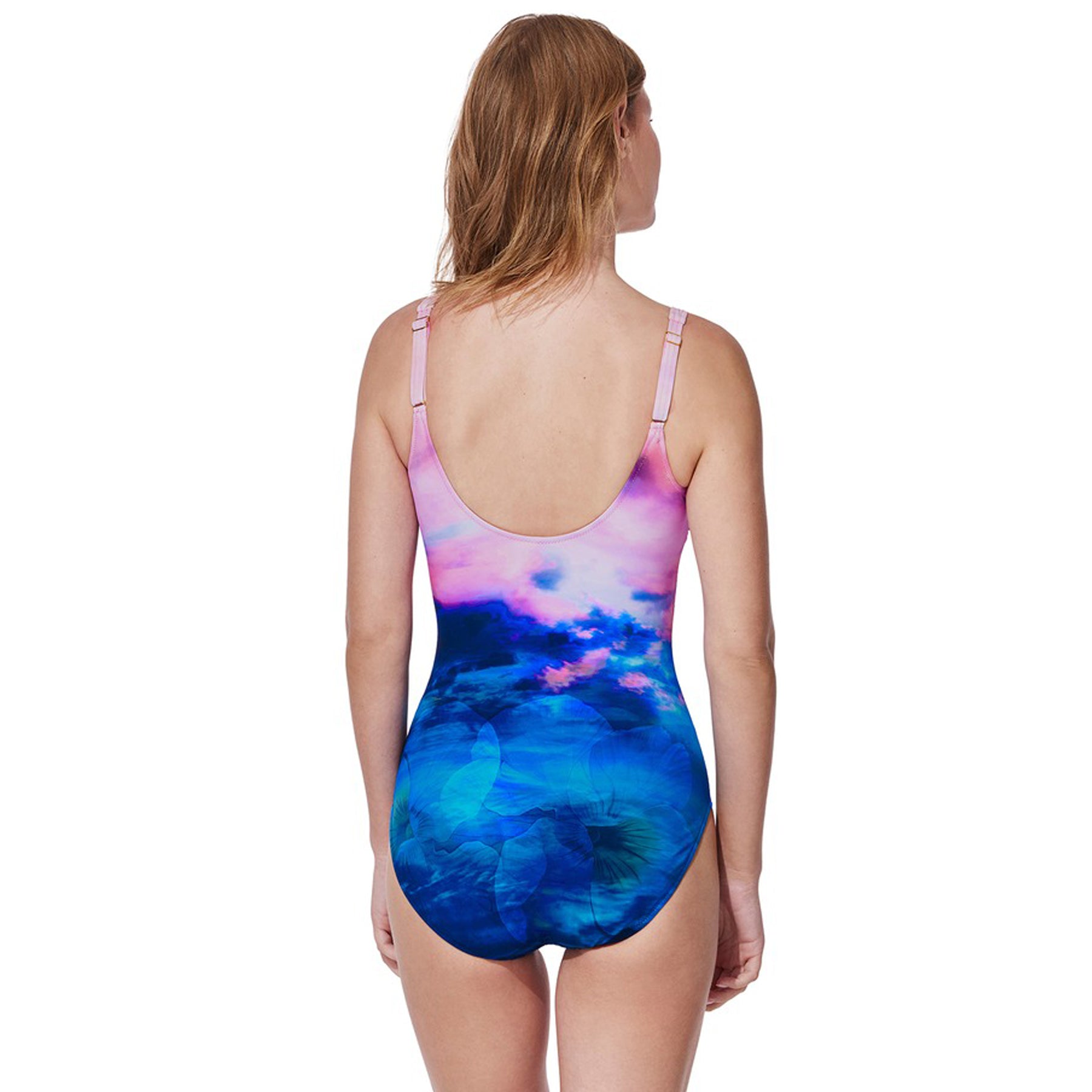 One-piece swimsuit with scoop back featuring a sunset-inspired pink and blue print.
