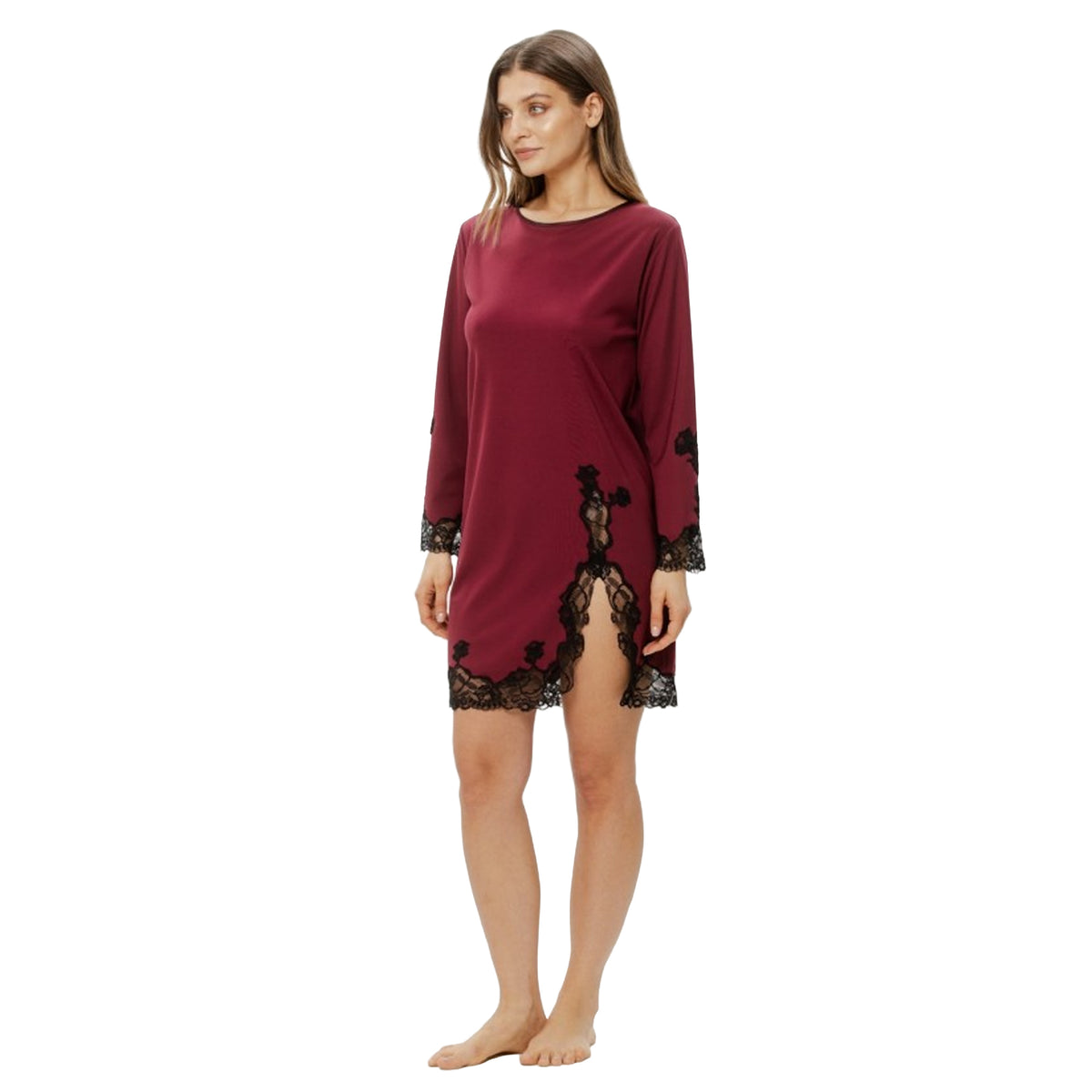 Model wearing Coemi berry red chemise with long sleeves, black lace accents and side slit