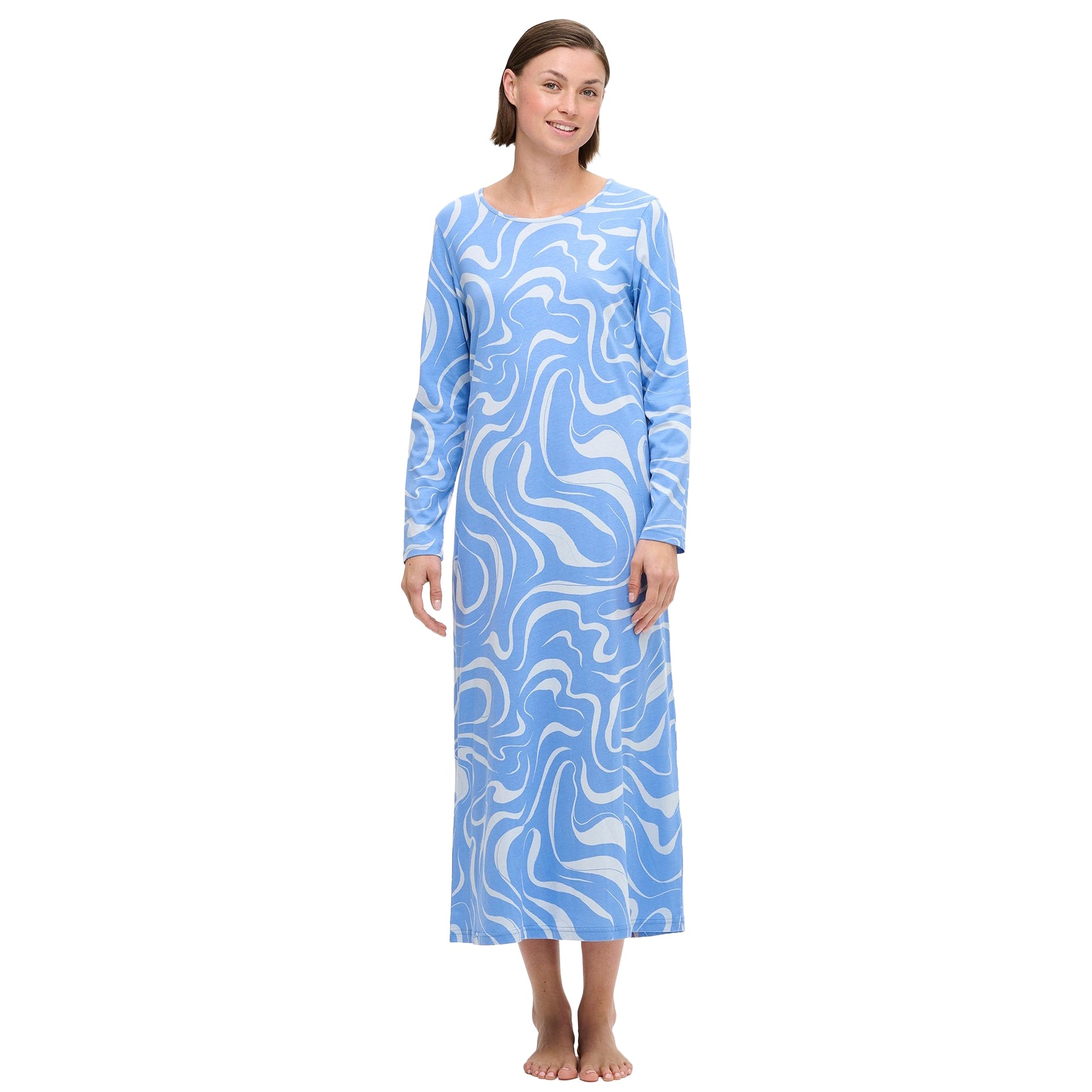 Close-up of light blue long-sleeve nightdress featuring a white abstract swirl pattern and round neckline, shown on model.