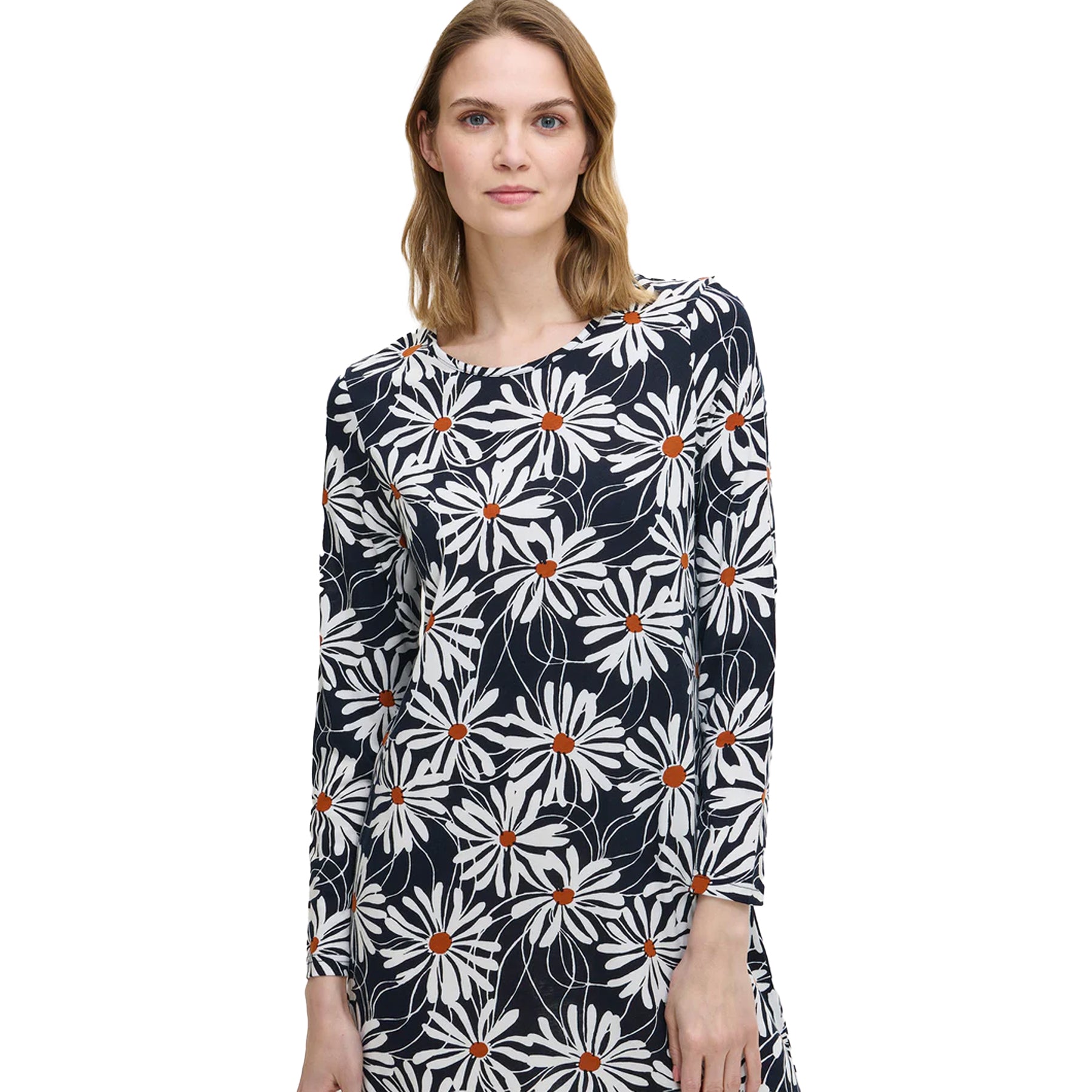 Woman wearing a navy floral nightdress with white daisy pattern and round neckline, showing soft cotton fabric detail.