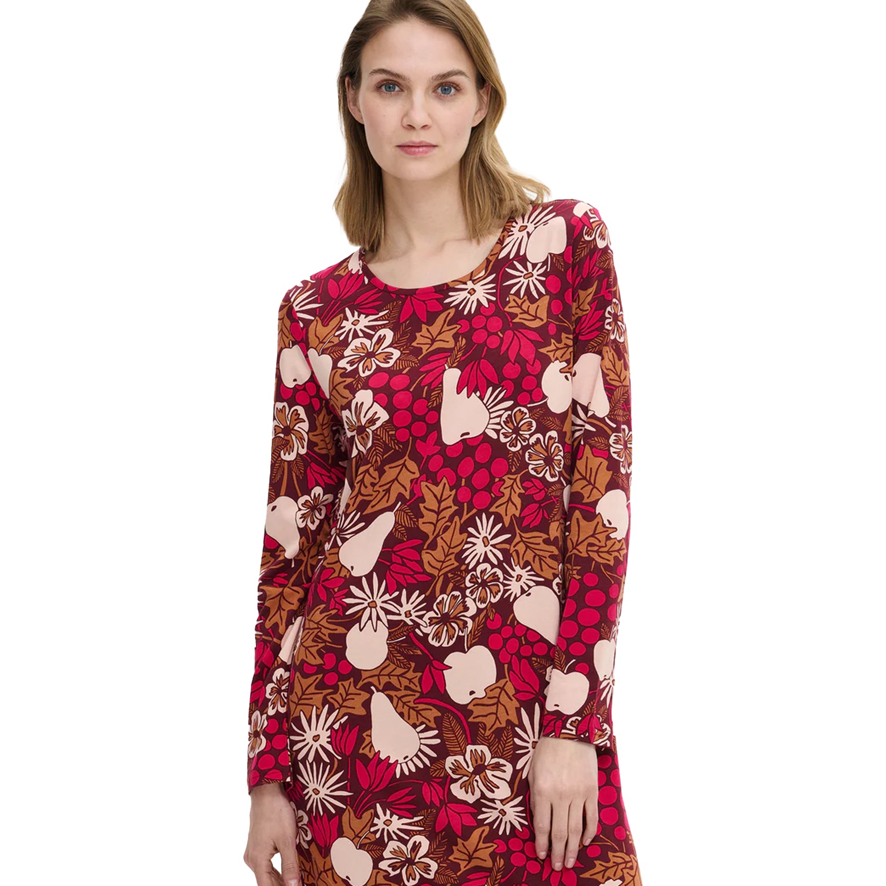 Woman wearing a burgundy floral-print nightdress featuring pears, flowers, and leaves in warm autumn shades, with a round neckline and soft cotton texture.