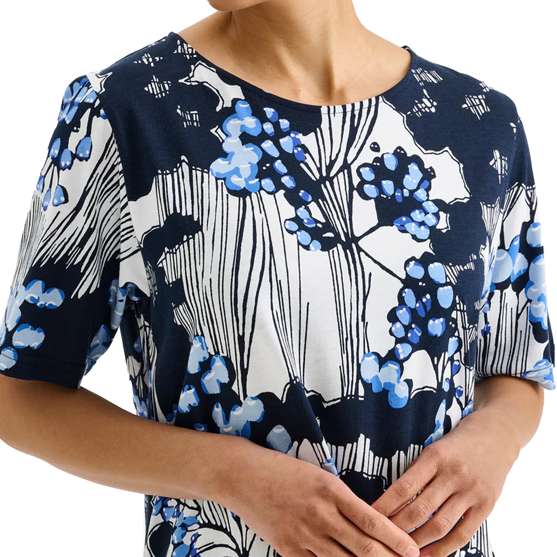 Close-up of navy floral nightgown with blue and white abstract botanical print, soft short sleeve sleepwear fabric detail
