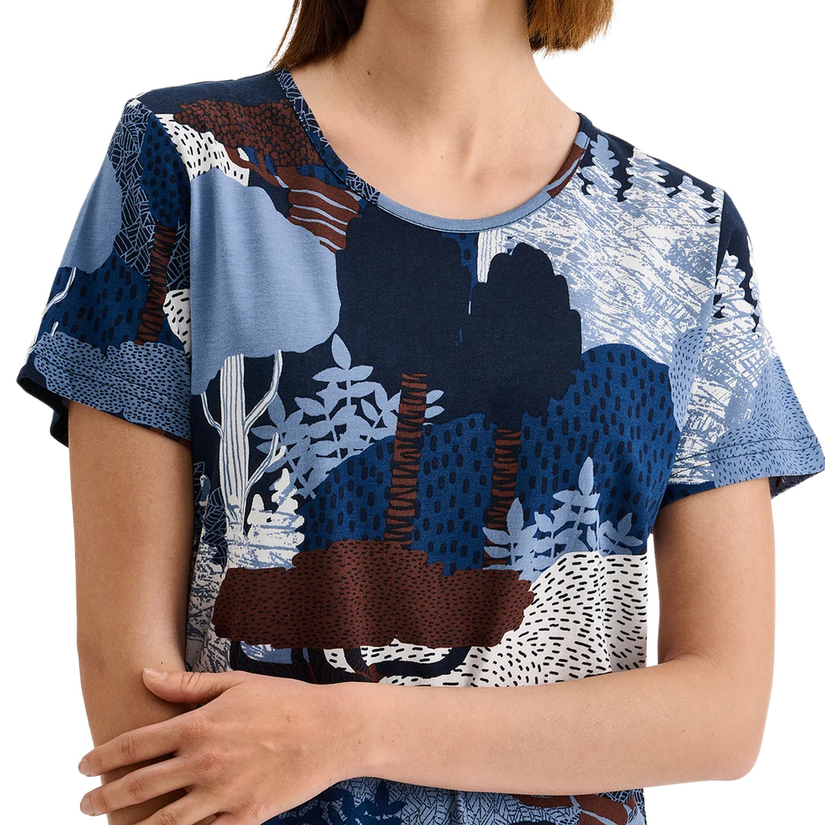 Close-up of Nanso chemise showing round neckline and detailed blue and brown woodland print