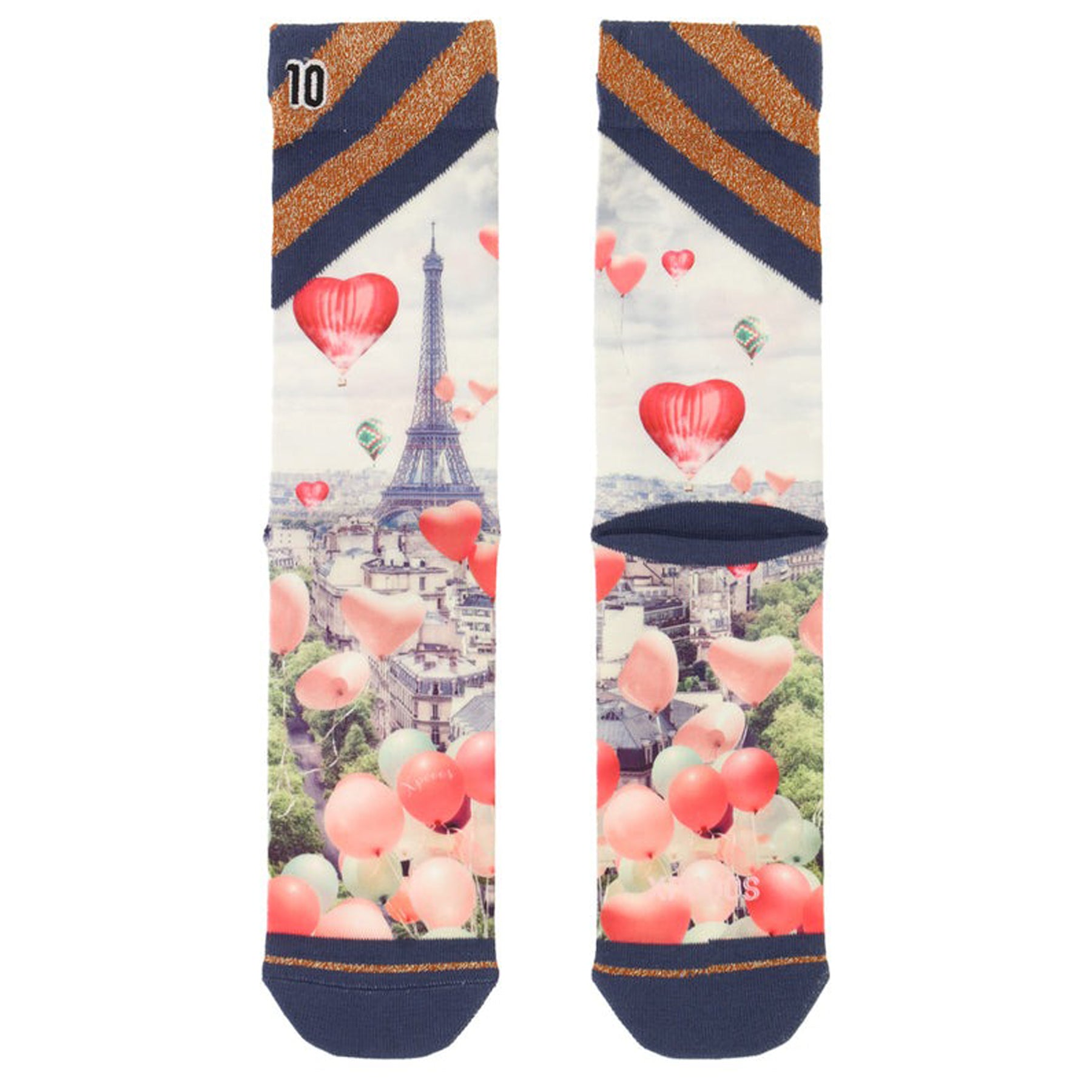 Pair of Eiffel Tower socks laid flat, decorated with red heart balloons and city skyline design.