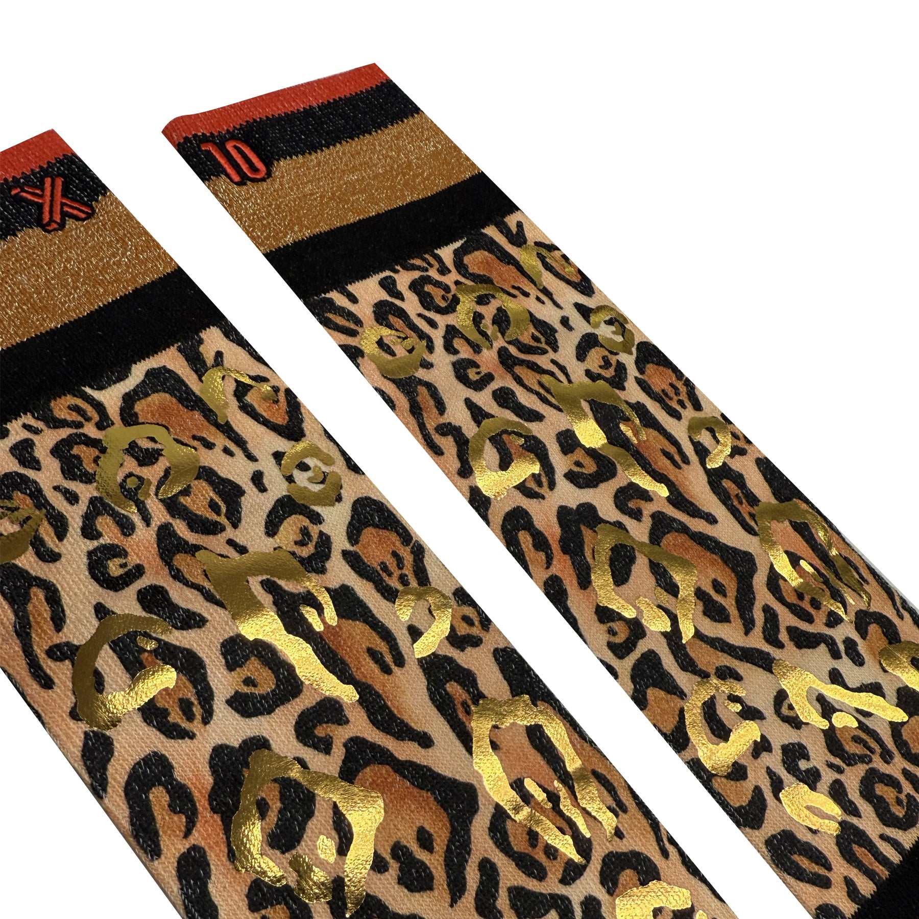 Pair of leopard-print socks with metallic gold details and striped cuffs in black, gold, and red, shown in a flat lay close-up.