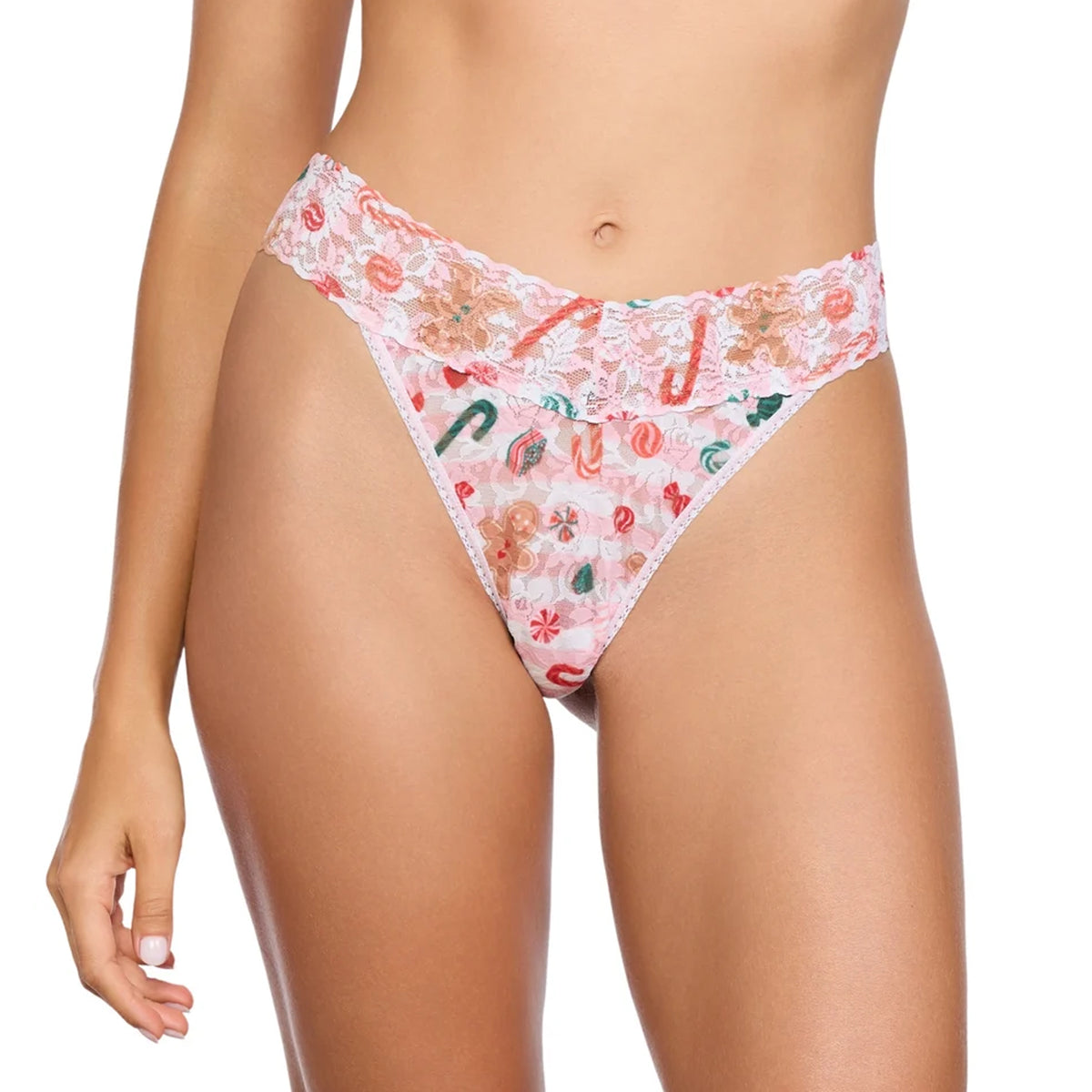 Front view of the Hanky Panky Signature Lace Original Rise Thong in Sugar and Spice, featuring a wide scalloped lace waistband and a festive pink print with gingerbread cookies, candy canes, and peppermint swirls.