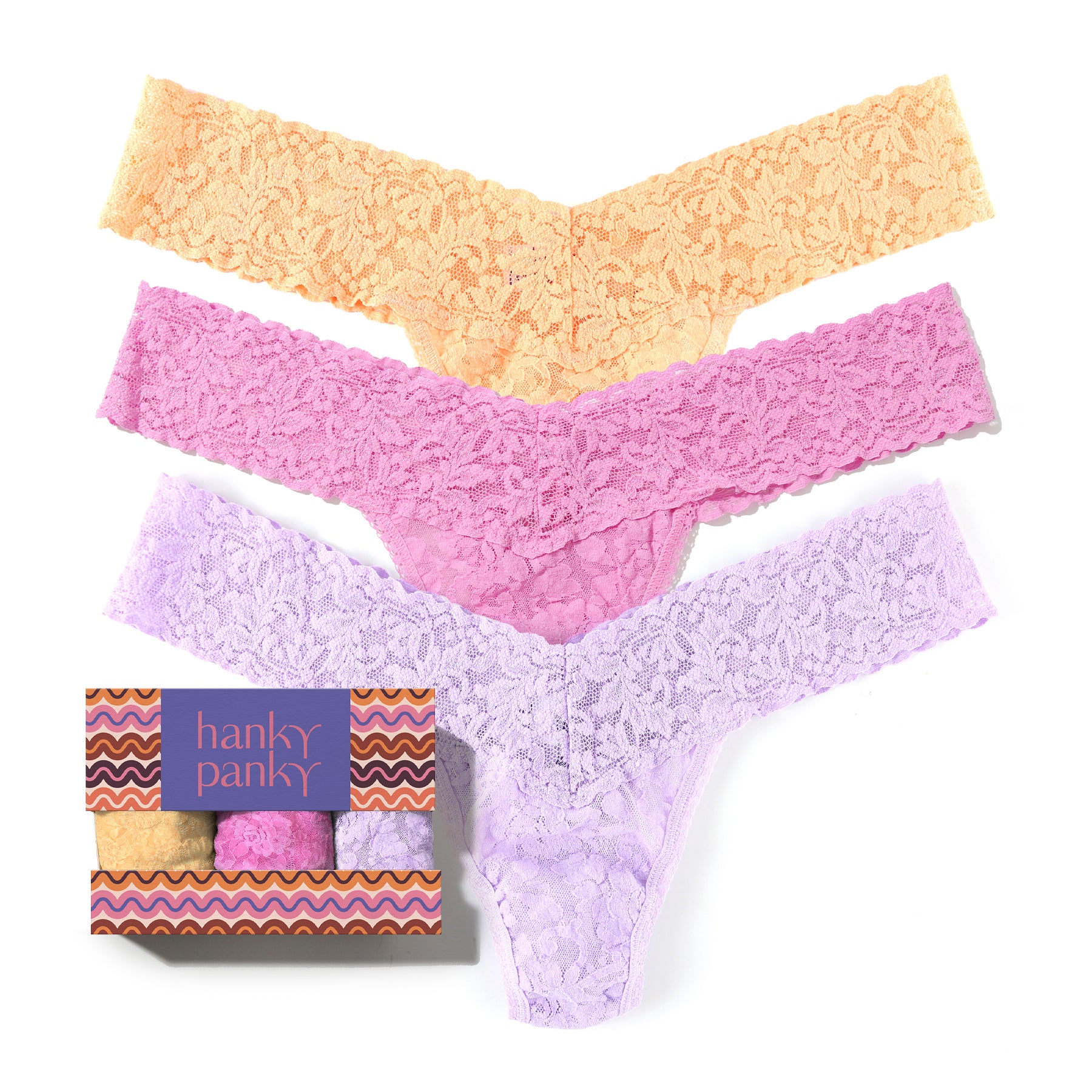 Hanky Panky Original Rise Thong three-pack in soft lace, shown with patterned gift box.