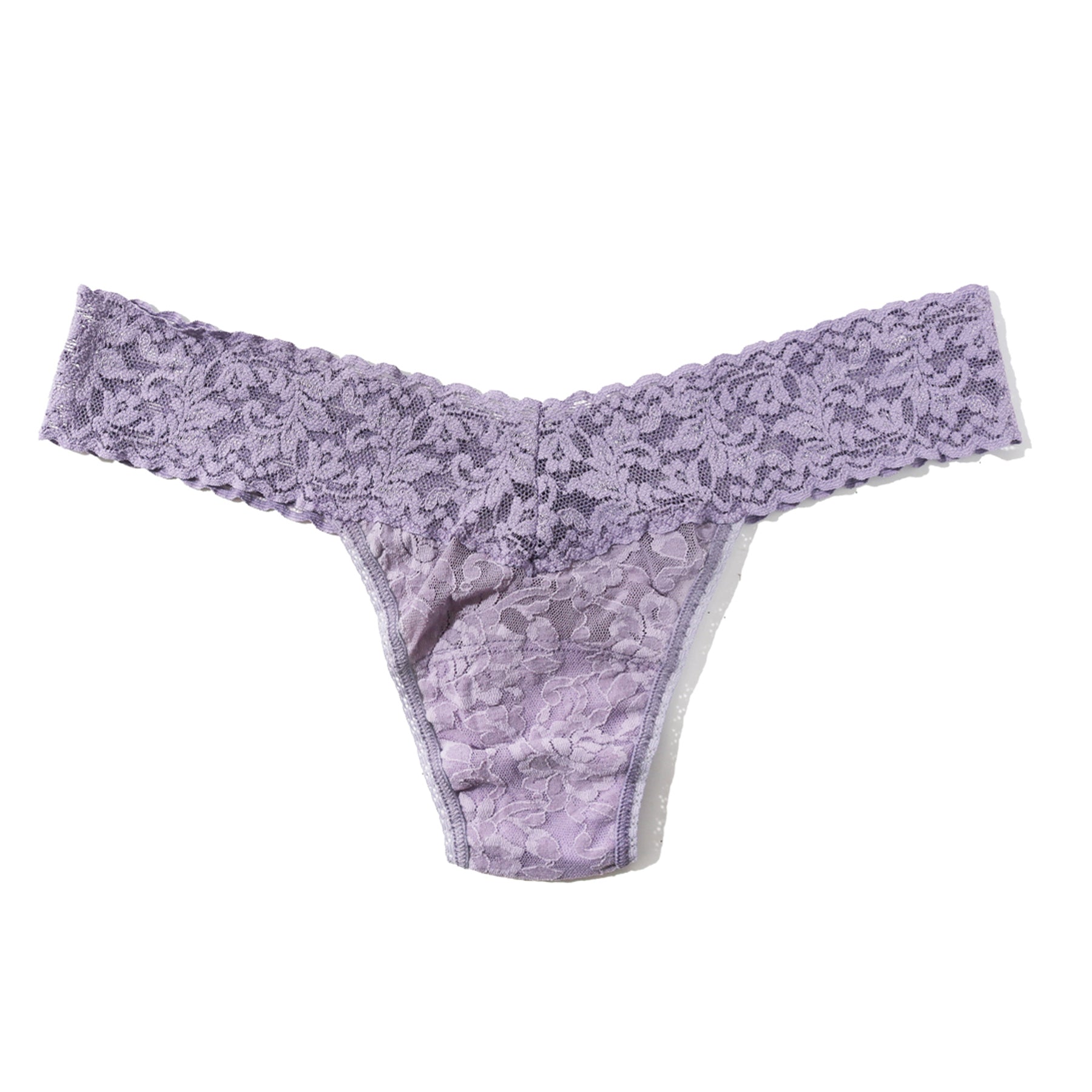 Light lavender lace thong laid flat, featuring wide floral lace waistband and soft sheer lace front panel