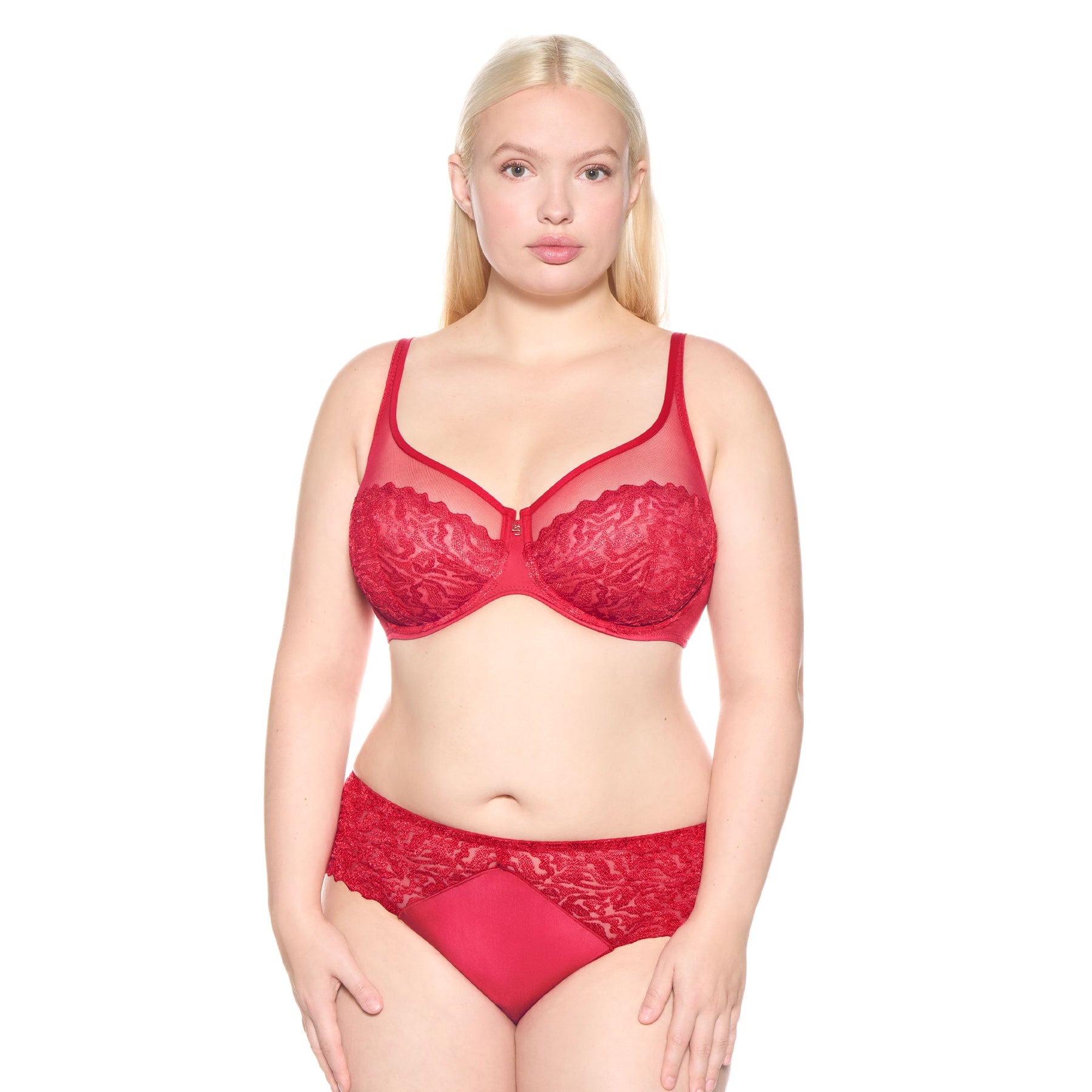 Model wearing the Louisa Bracq Waves Plunge Bra in red with sheer mesh and embroidered lace, paired with matching briefs.