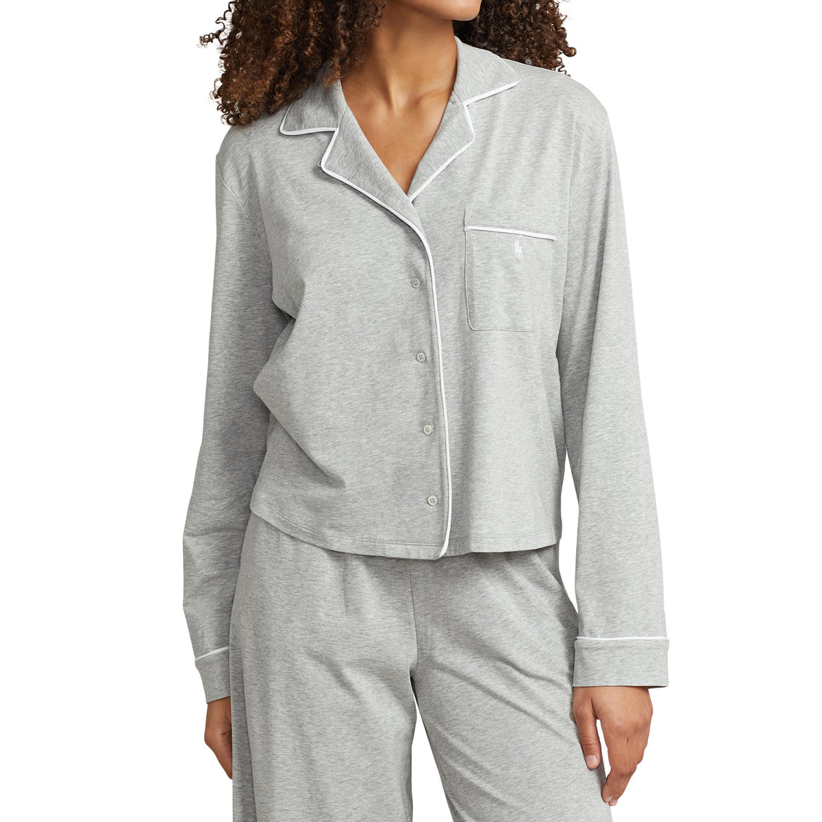 Close-up of Polo Ralph Lauren heather grey pyjama set featuring a button-front shirt, notched collar, white contrast piping, and embroidered chest pocket.