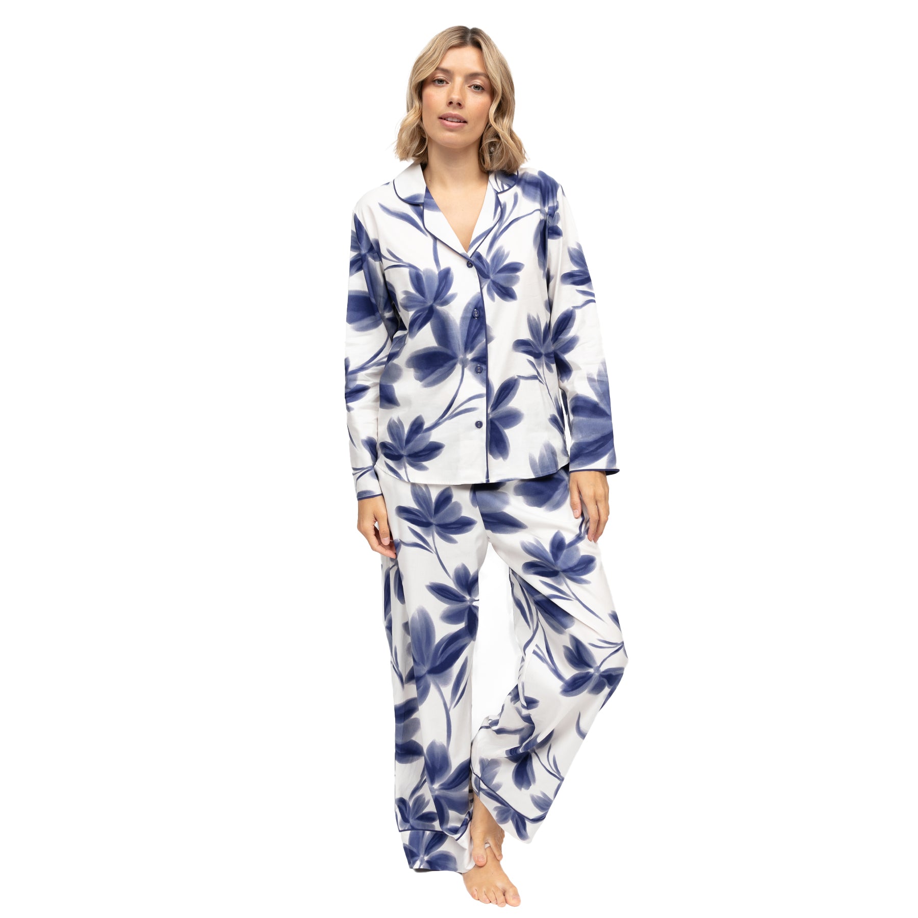 View of women’s navy floral print pyjama set with long sleeve top and coordinating full-length pants.