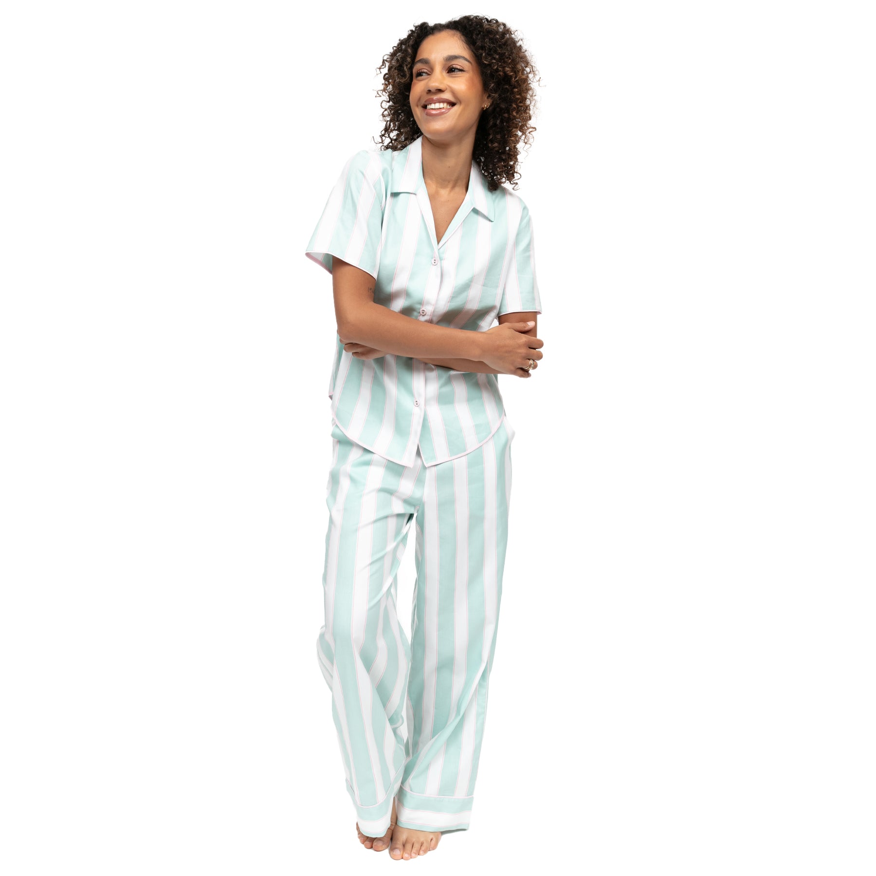 Woman modeling mint green striped pajama set, lightweight fabric with relaxed, comfortable fit
