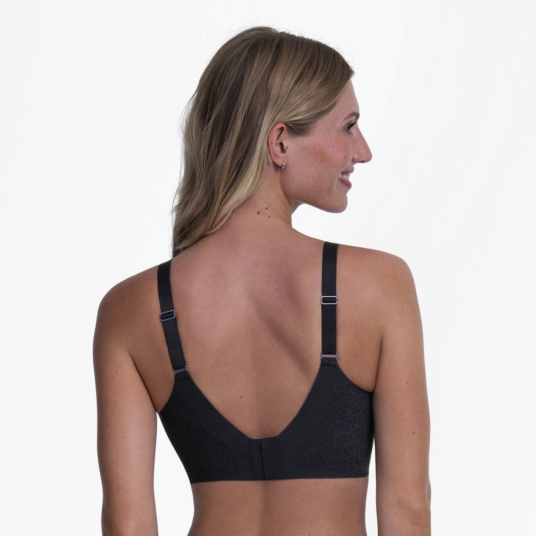 Back view of a Shadow Blue wireless bra featuring adjustable straps, a wide smoothing back, and a secure hook-and-eye closure.
