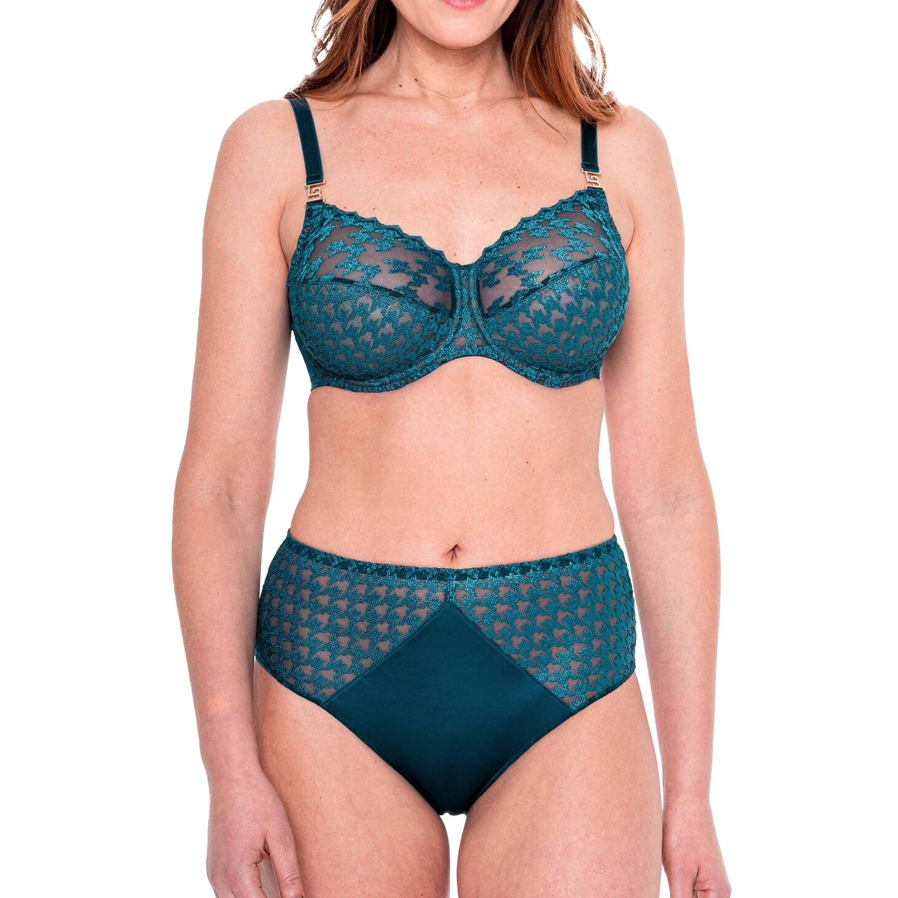 Woman wearing matching teal lace bra and high-waist brief set with sheer houndstooth detailing.
