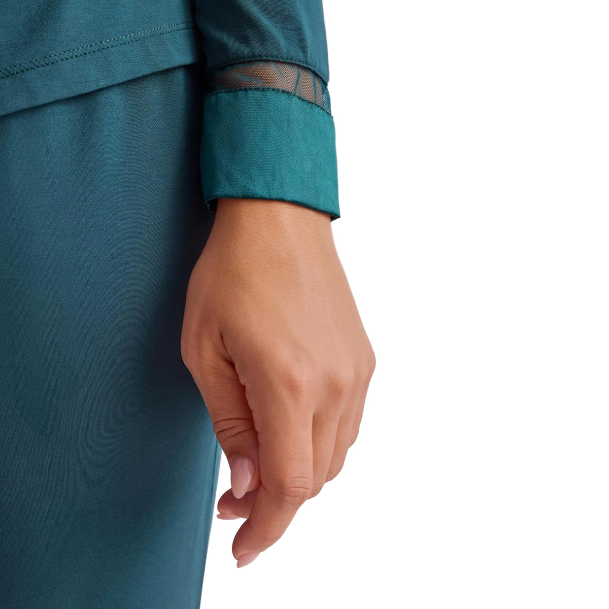 Close-up of Fleurt Deep Spruce pajama set showing soft teal fabric, sheer mesh trim and wide sleeve cuff detail.