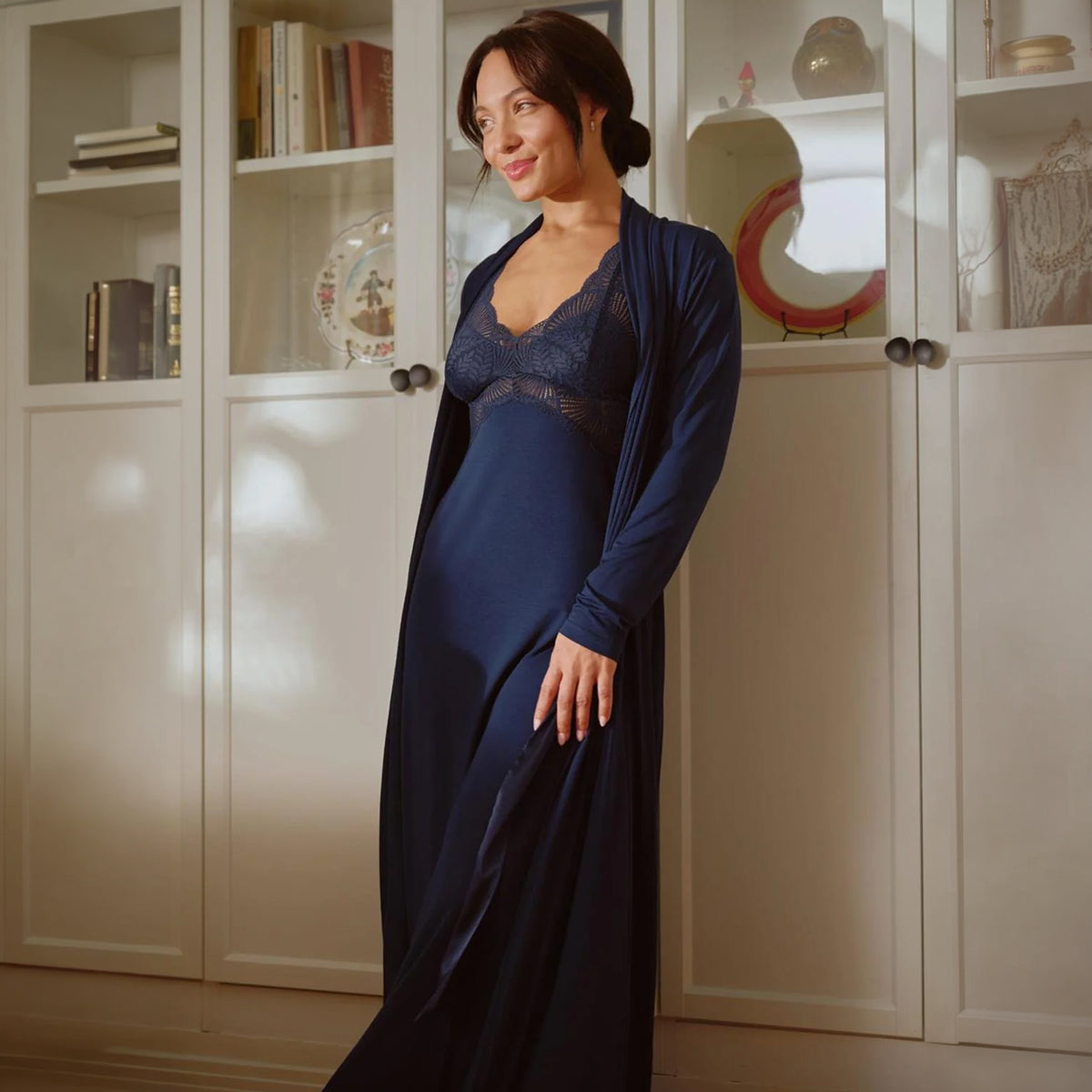 Model wearing Fleurt Iconic Long Robe in Ink navy over a matching lace-trimmed chemise, lifestyle front view.