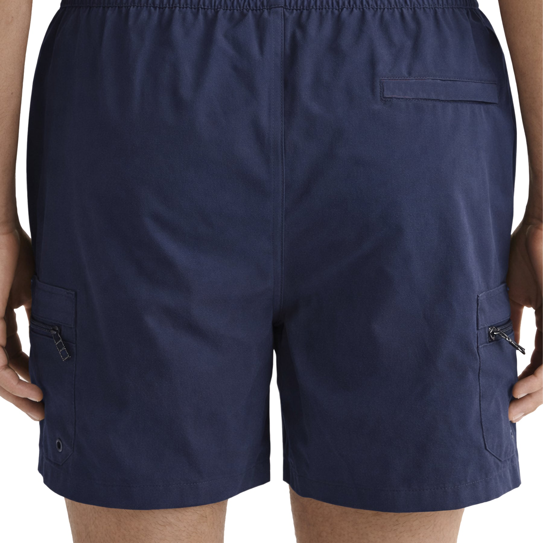 Back view of navy men’s swim shorts featuring rear pocket and side zip cargo pockets.
