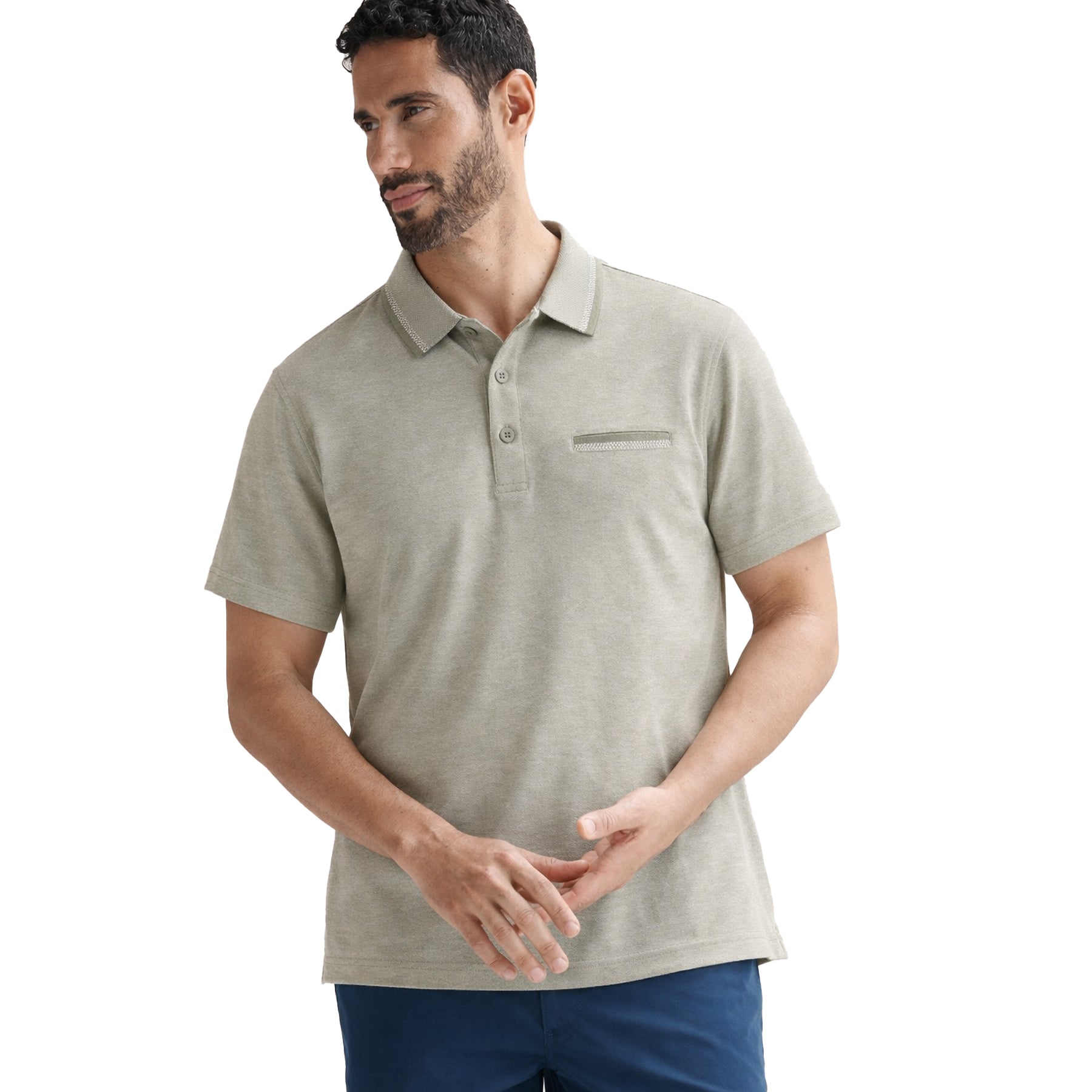 Men wearing sage green polo shirt styled casually with blue shorts, photographed on white background