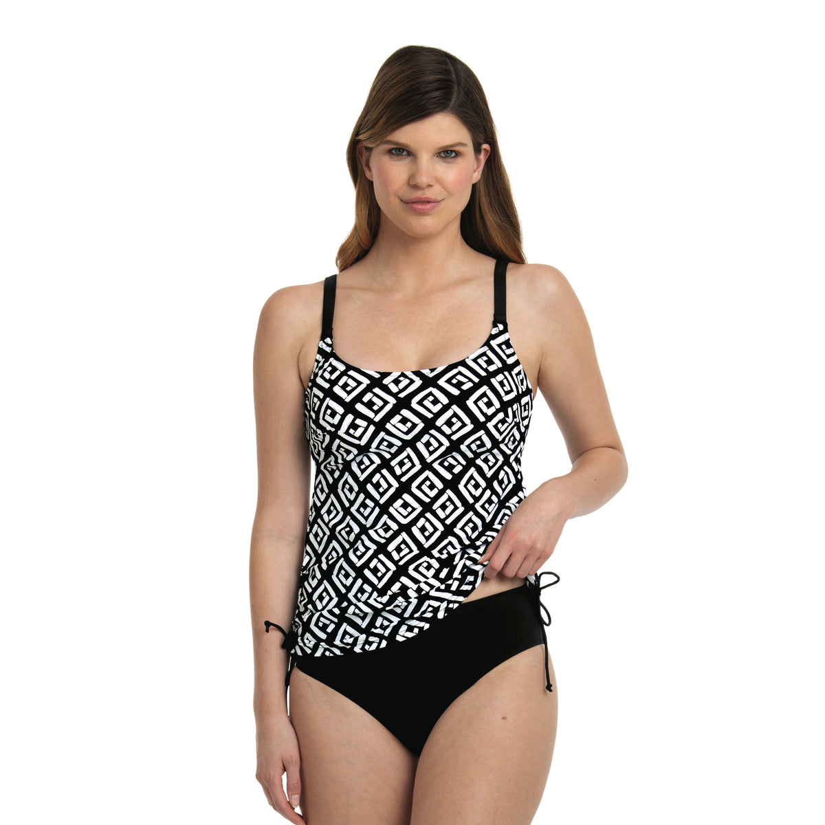 Model wearing a black and white geometric print tankini top with adjustable straps and side drawstrings, paired with black swim bottoms.