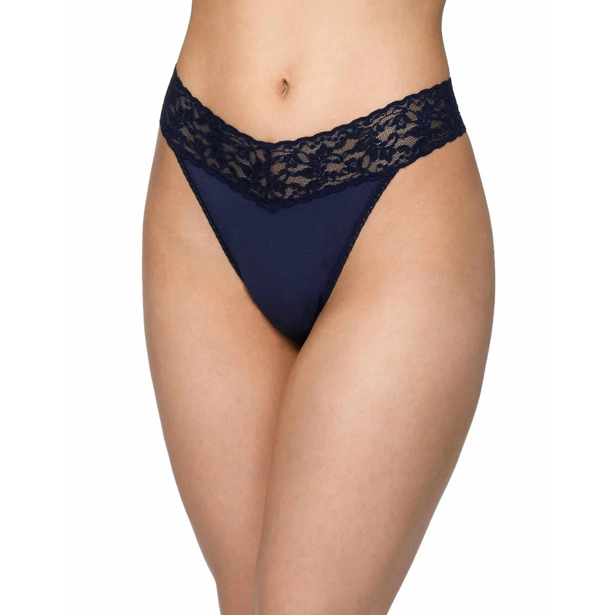 Model wearing the Hanky Panky Supima Cotton Original Rise Thong in Navy, featuring a smooth navy cotton front panel, wide floral lace waistband, and delicate scalloped edges.