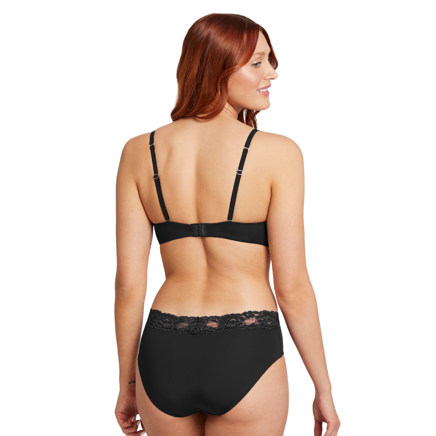Three-quarter back view of a model wearing the black wireless bra and matching brief, showing strap placement and smooth fit.