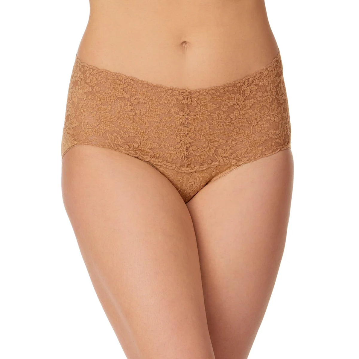 Model wearing the Hanky Panky Retro Rise Thong in Suntan beige, showcasing sheer floral stretch lace, a wide V-shaped waistband, scalloped trim and minimal thong coverage.