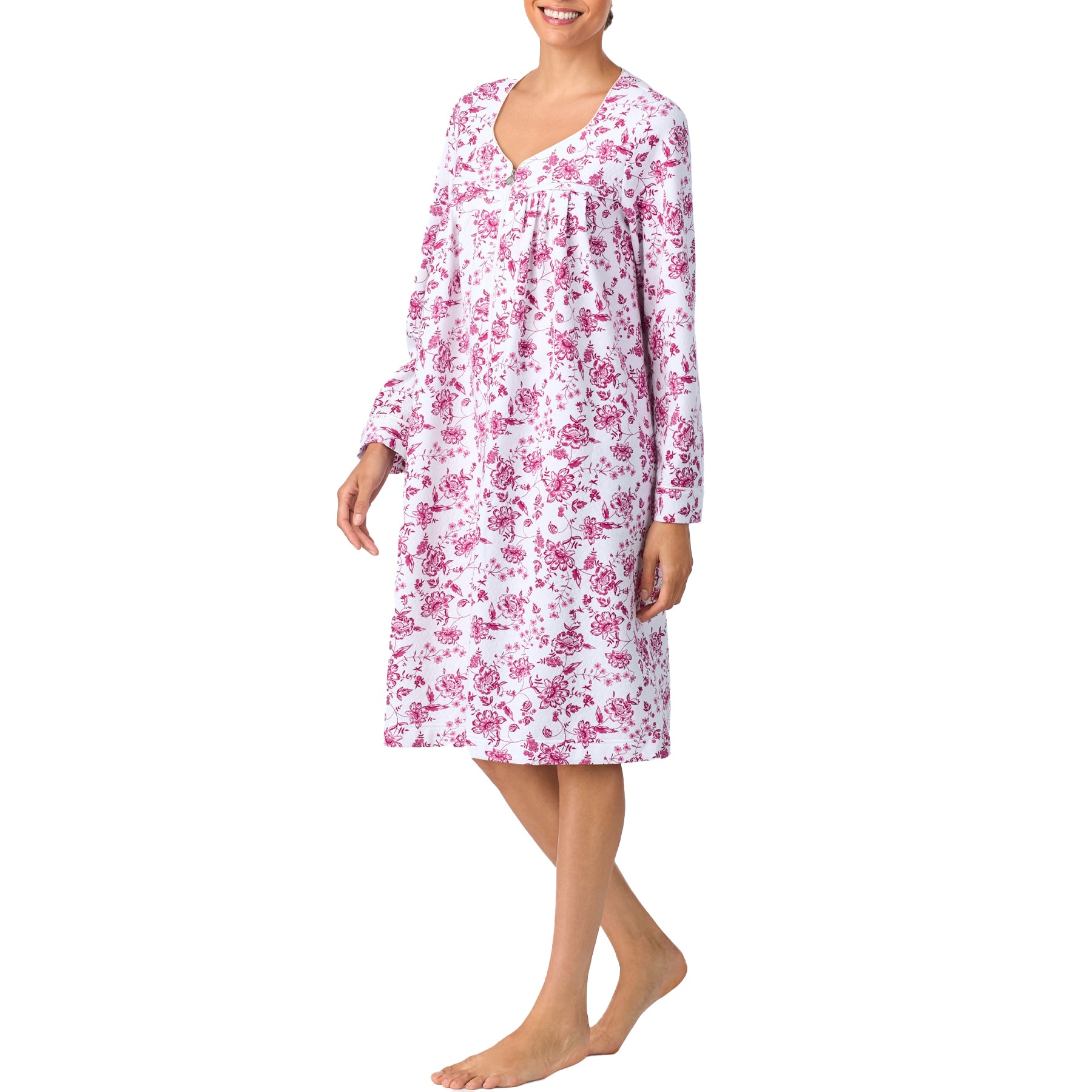 Front view of a long-sleeve white nightgown with pink floral pattern and zip closure, mid-length design.