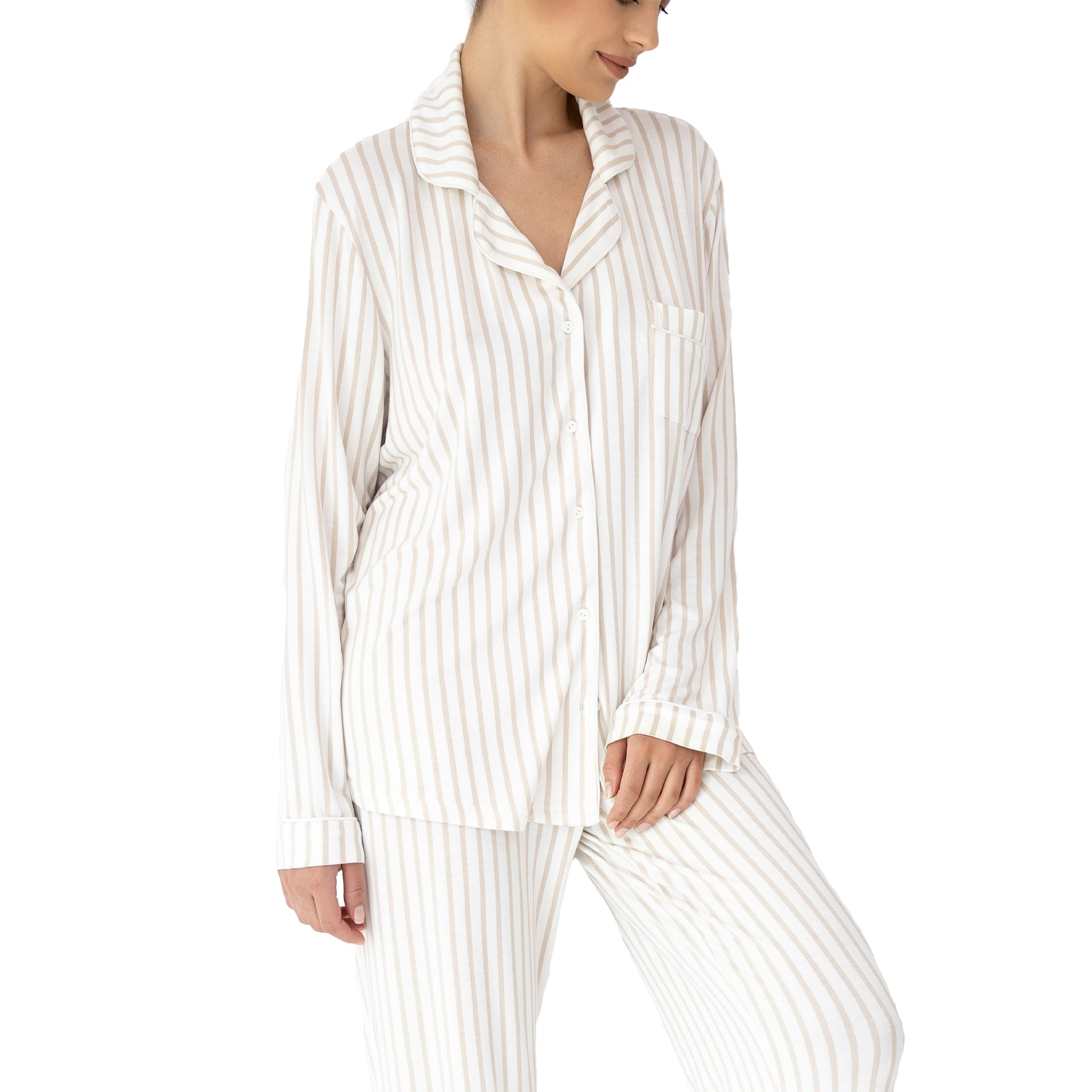 Close-up of striped pyjama set with button-front shirt, chest pocket and soft drape fabric in ivory and beige tones