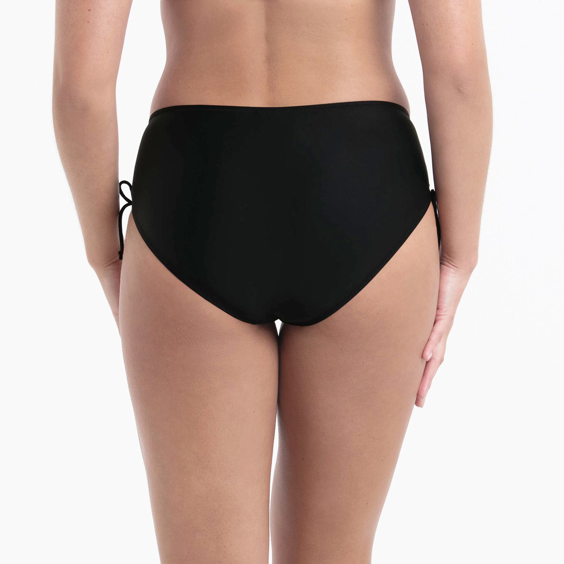 High-waist bikini bottom back view in solid black with adjustable side ties from Anita Swim in magenta print collection