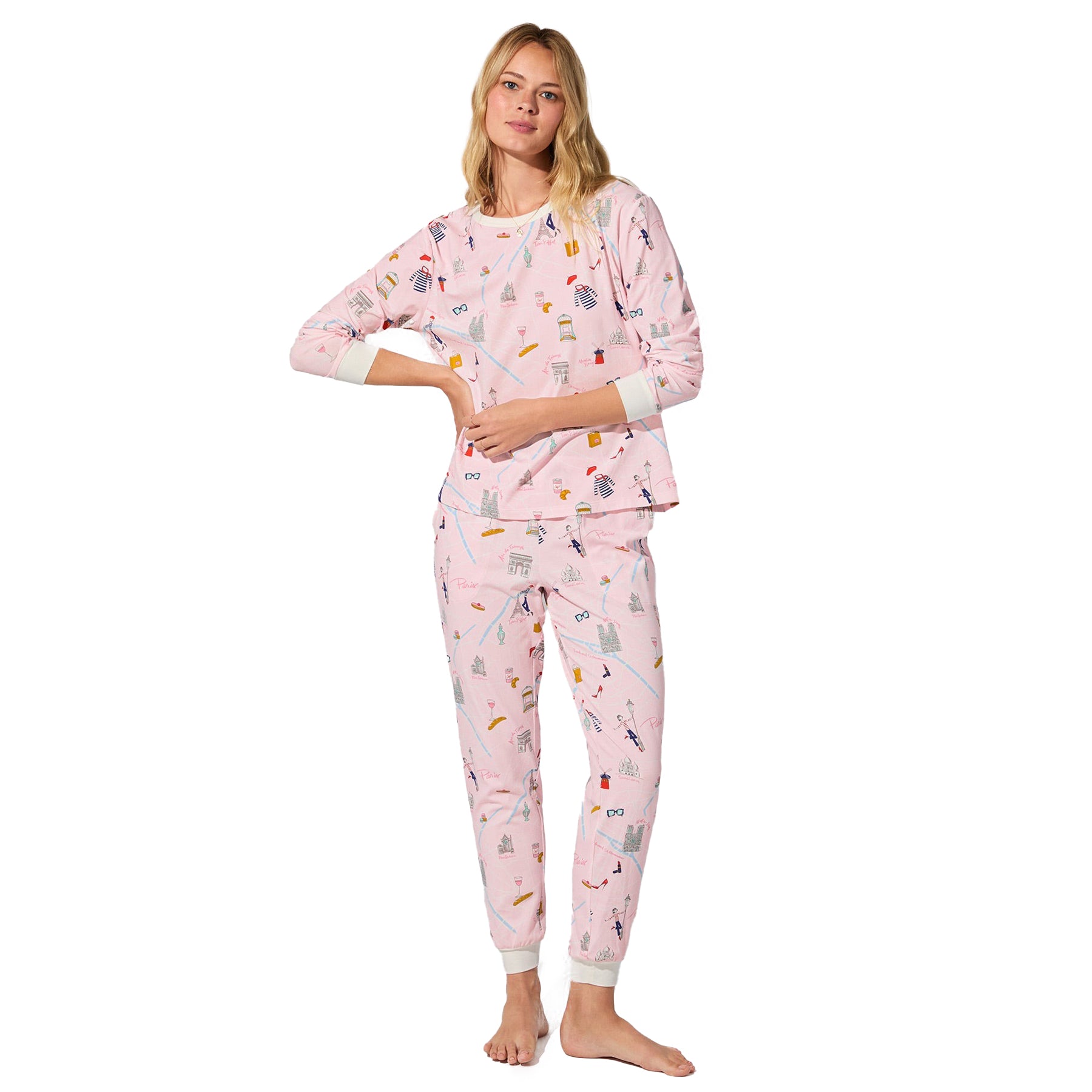 Front view of straight-size model wearing blush pink Paris print pajama set with long sleeves and jogger pants.
