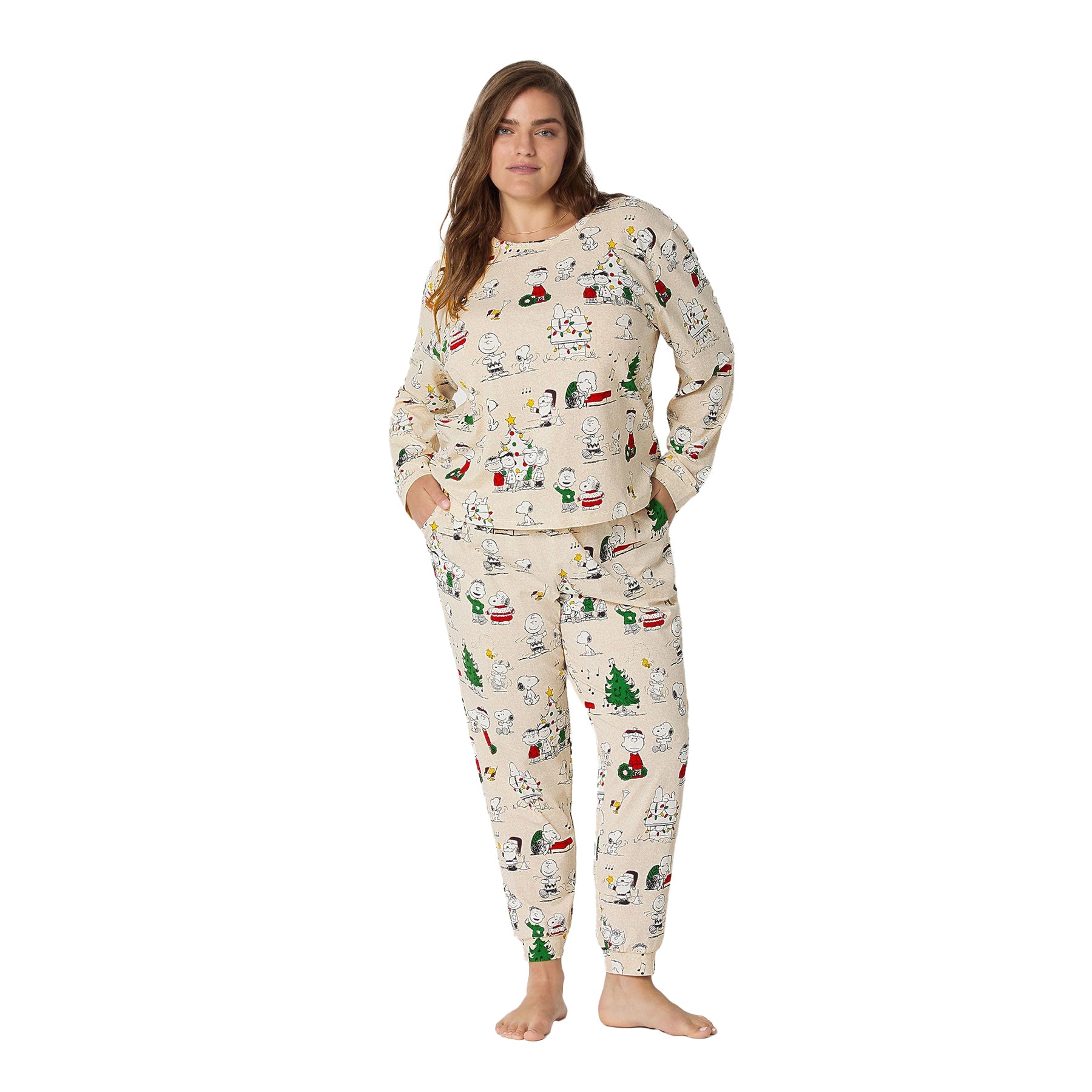 Woman wearing a festive pajama set with Christmas-themed design on a white background