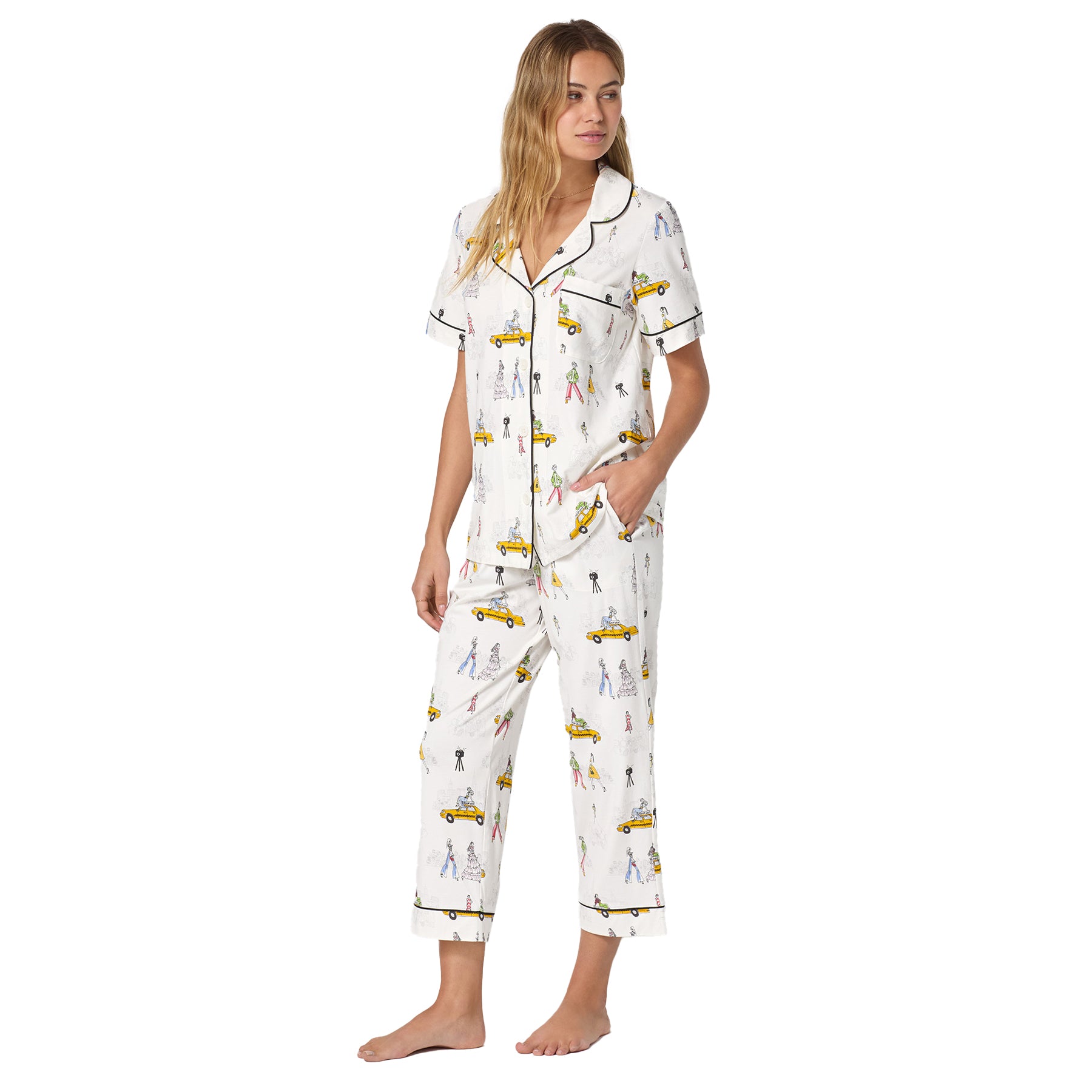 Three-quarter side view of the fashion print pyjama set showing the relaxed fit, contrast piping, and ankle-length pants.
