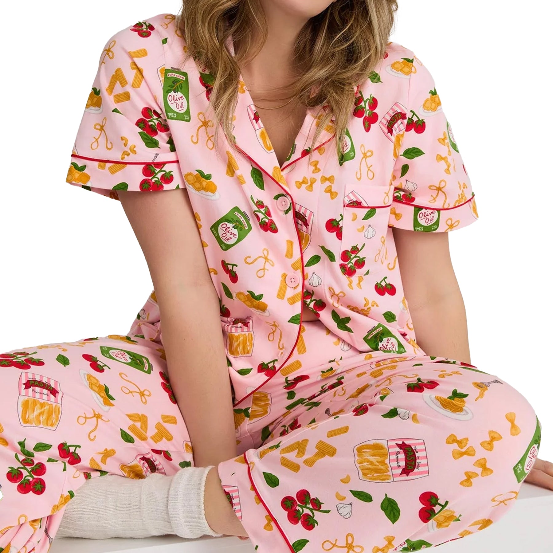 Close-up of BedHead pink pasta print pajama PJ set featuring olive oil bottles, pasta, tomatoes, and contrast piping details.