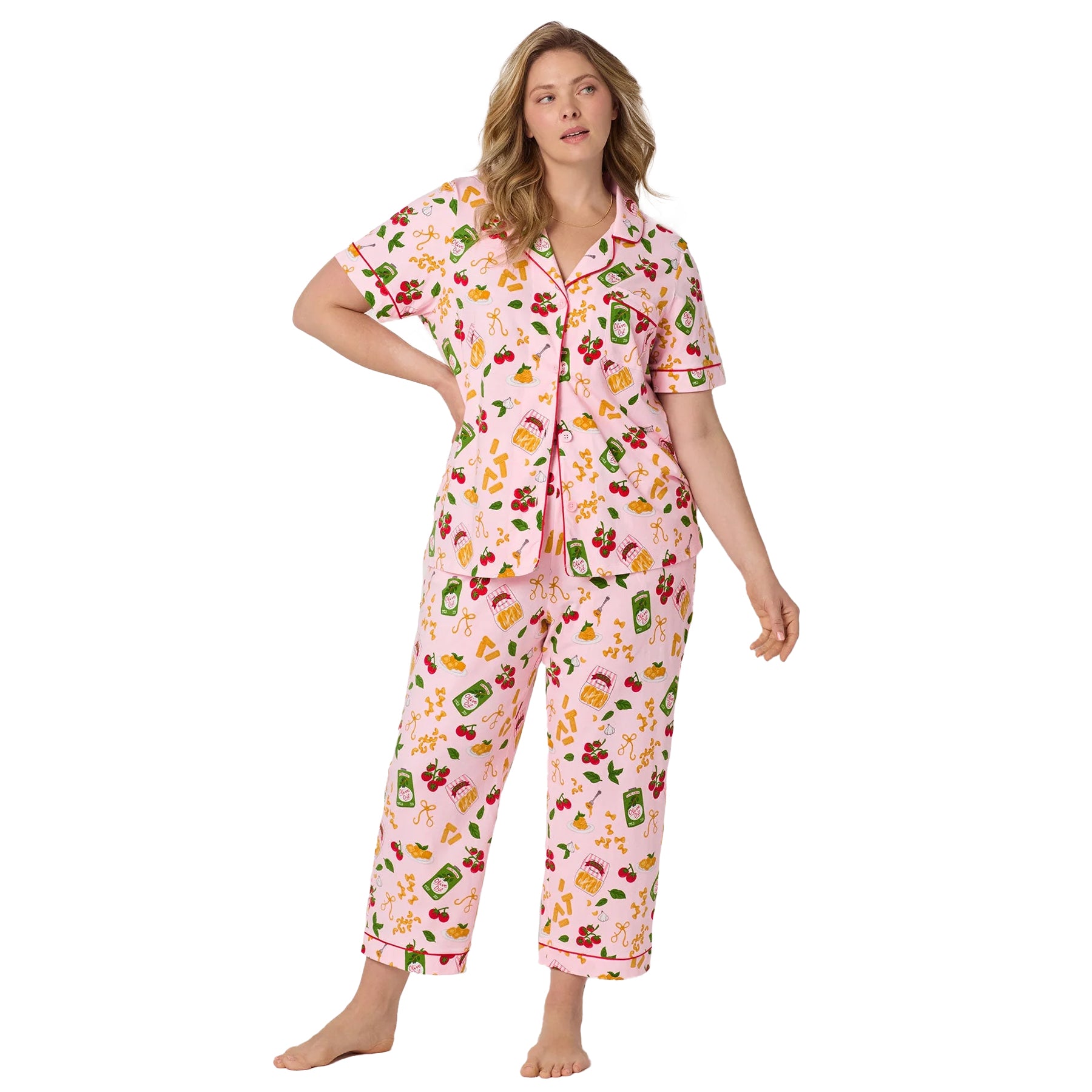 Woman modeling Bedhead pink pasta print pajama PJ set with lightweight cropped sleep pants and relaxed silhouette.