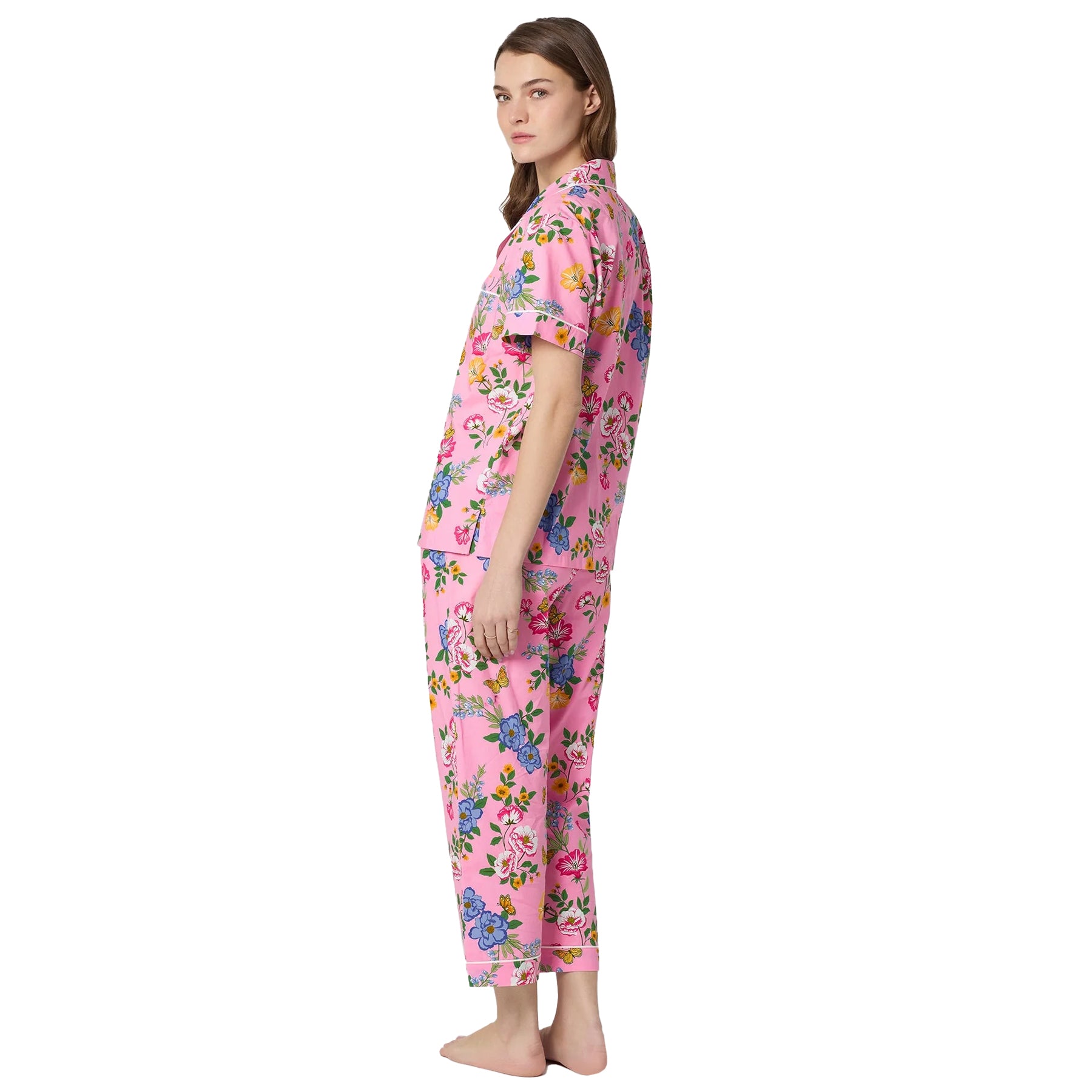 Back side view of Bedhead floral pajama set with pink background and colourful blooming flower pattern.