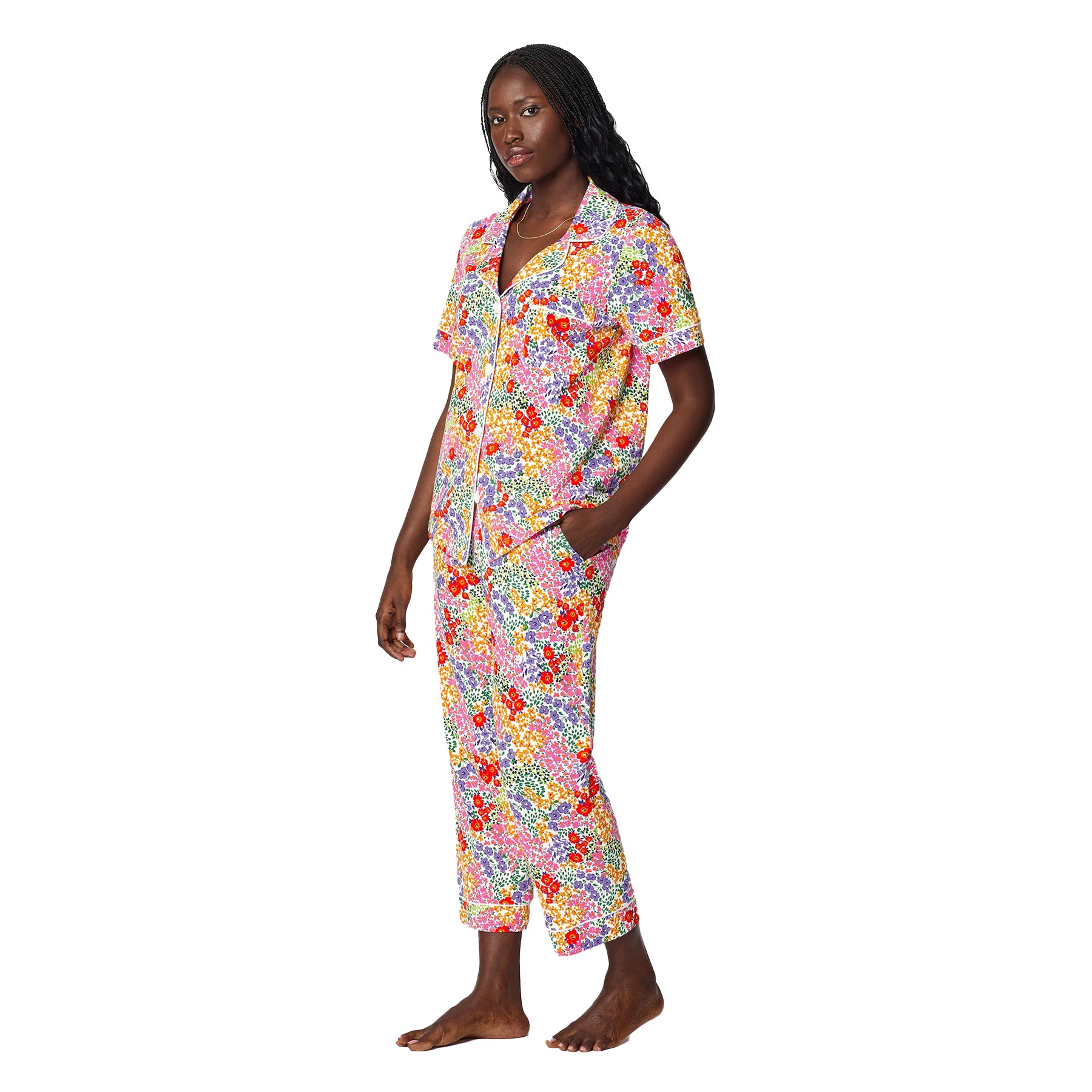 Side view of colourful floral cotton pajama set with relaxed fit short sleeve top and ankle-length cropped pants.