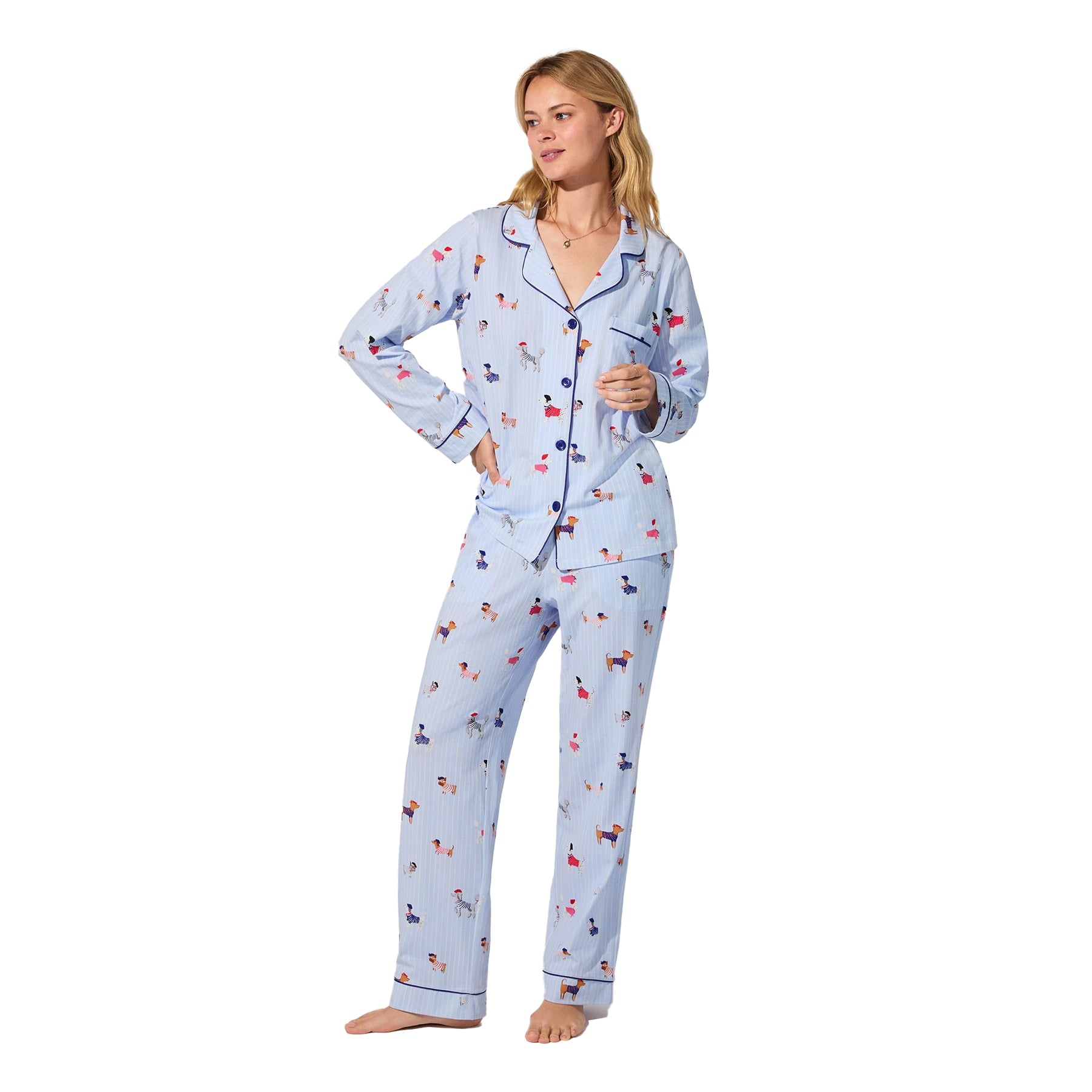 Light blue pinstripe pyjama set with colourful dog print and navy piping, front view on model