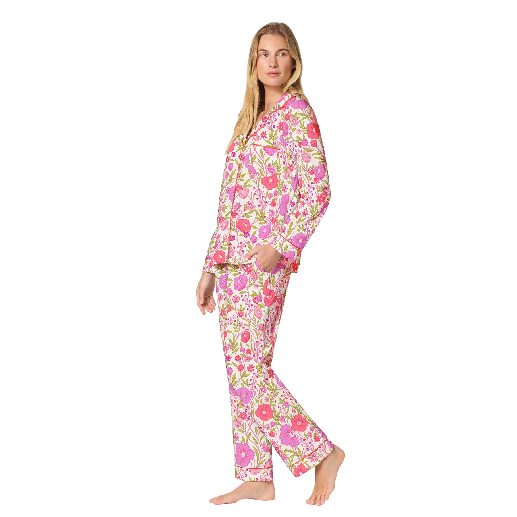 Side view of a white long-sleeve pajama set featuring an all-over pink floral print, chest pocket and full-length pants.