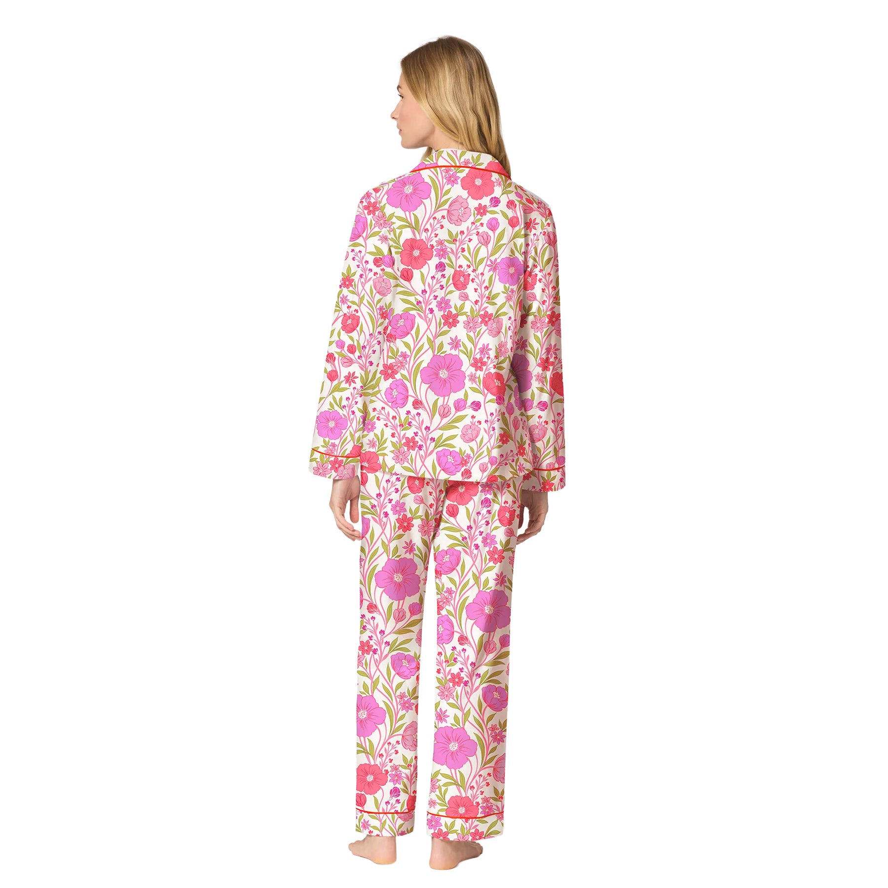 Back view of a white long-sleeve pajama set with vibrant pink flowers, green leaves and full-length pants.