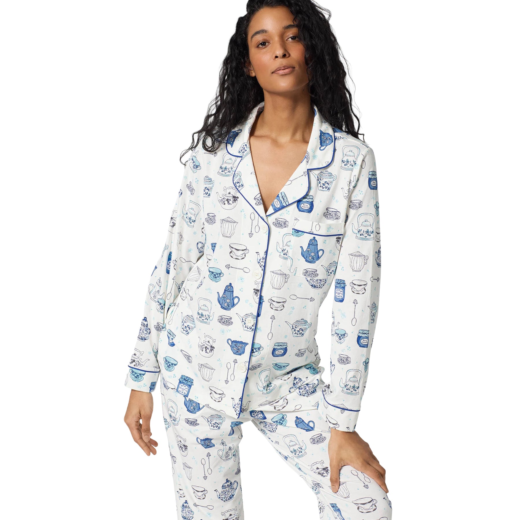 Model wearing white BedHead pajamas with a blue tea-themed print, button-front top, long sleeves and contrast piping.