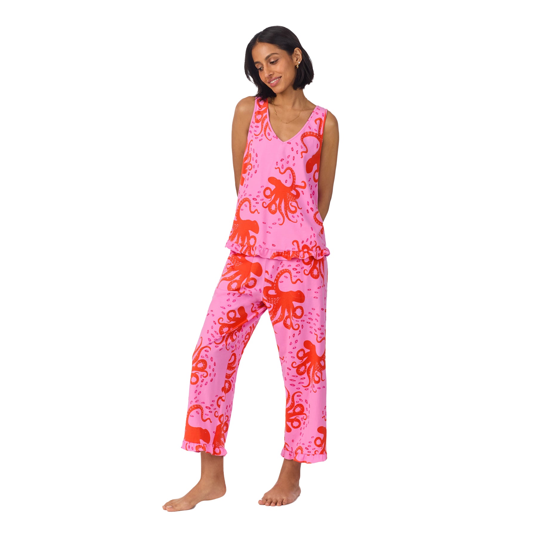 Model standing with hands behind her back, wearing the full octopus pajama set with a relaxed expression.