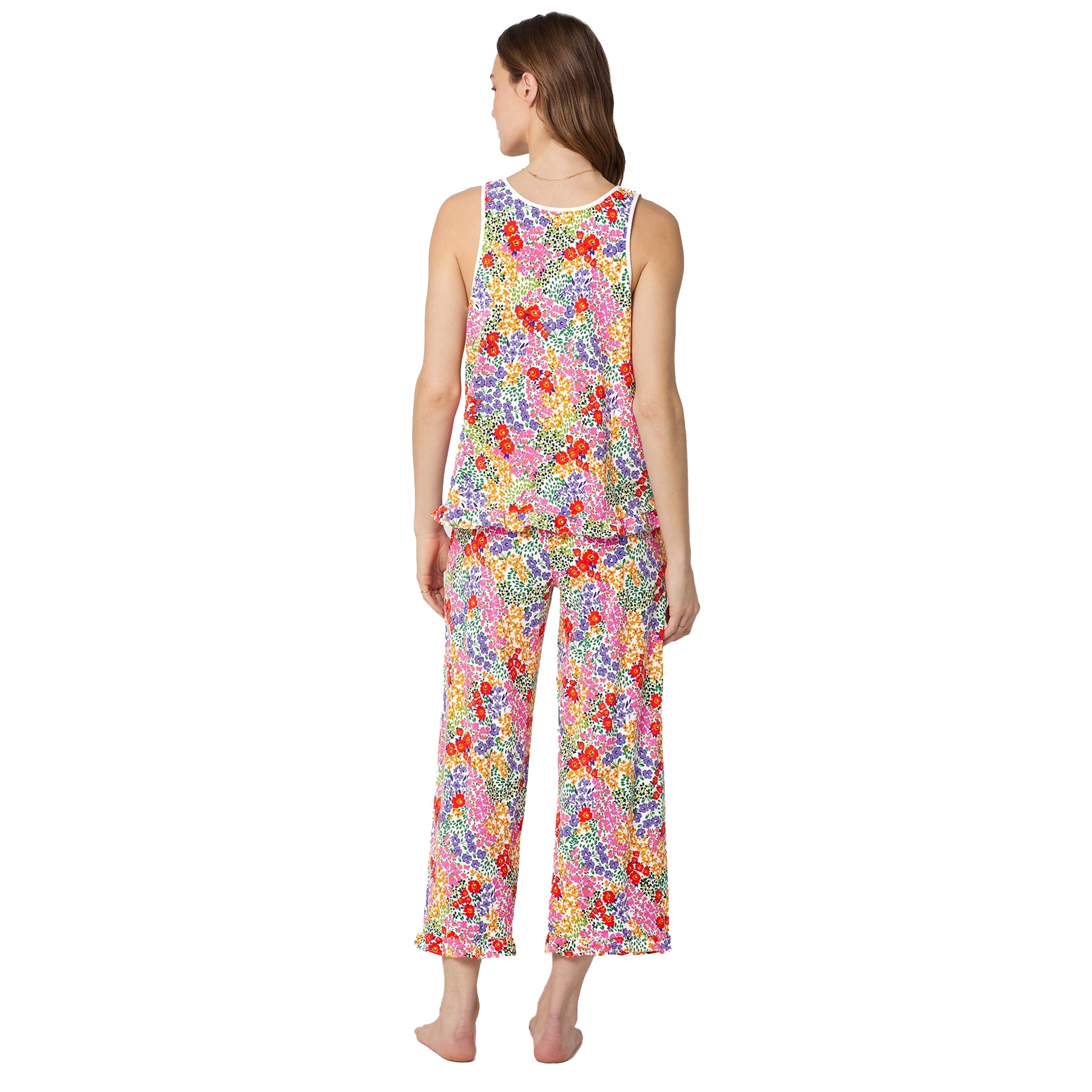 Back view of women’s sleeveless floral pajama set with ruffle hem top and wide leg cropped pants in vibrant multicolour botanical print.