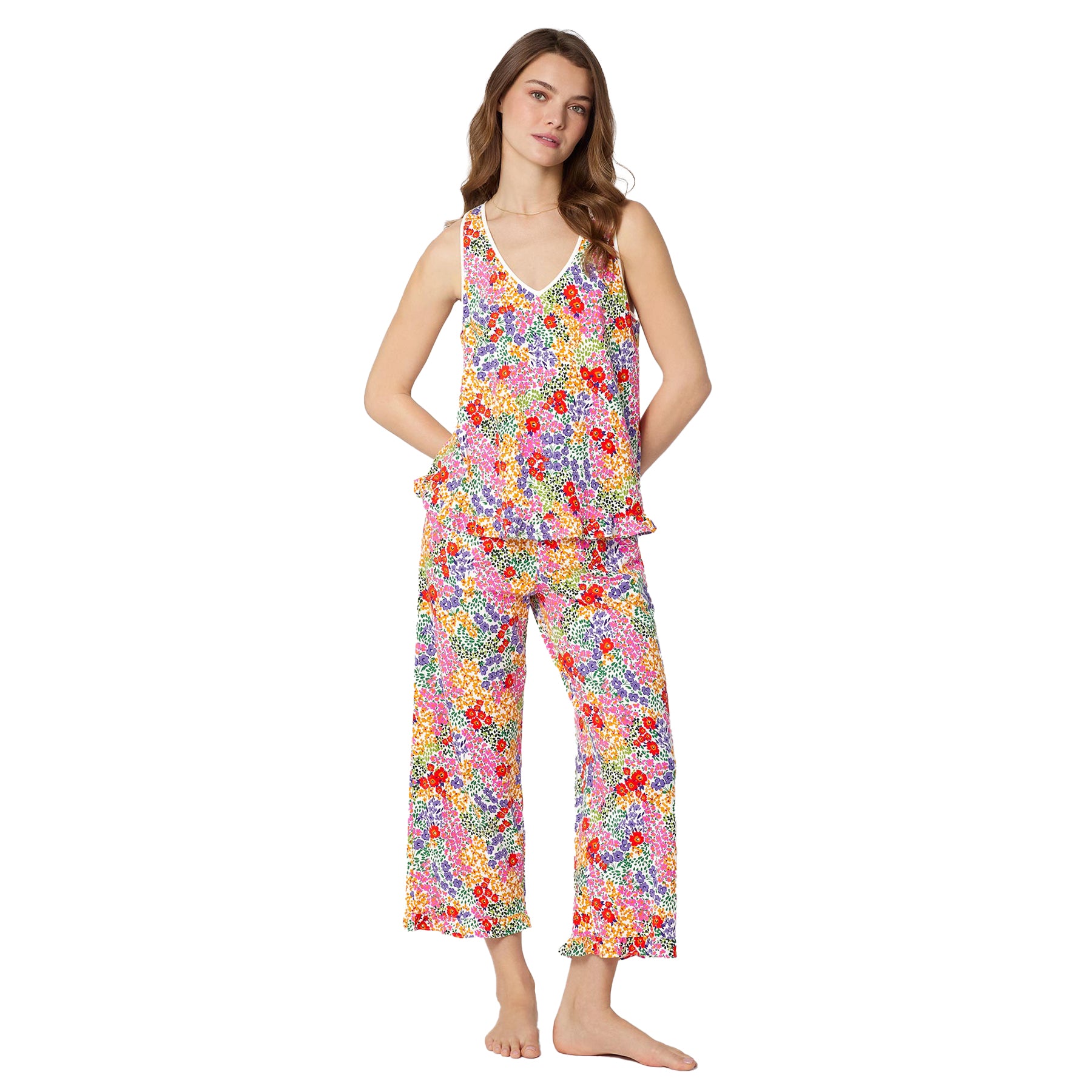 Front view of women’s sleeveless V-neck pajama set featuring colourful floral print top with ruffle detail and matching cropped pants.