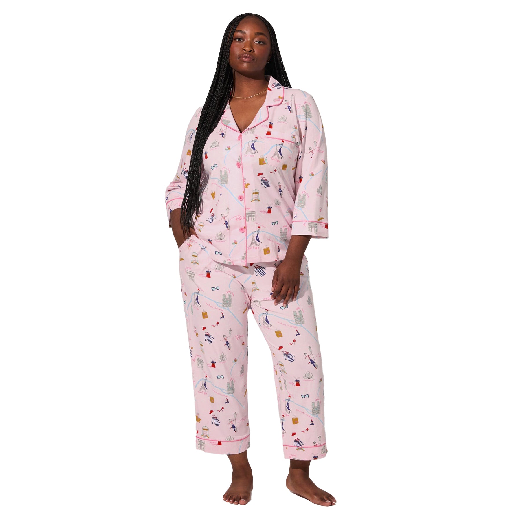 Front view of plus-size model wearing pink Paris print cropped pajama set with three-quarter sleeves and button-front top.