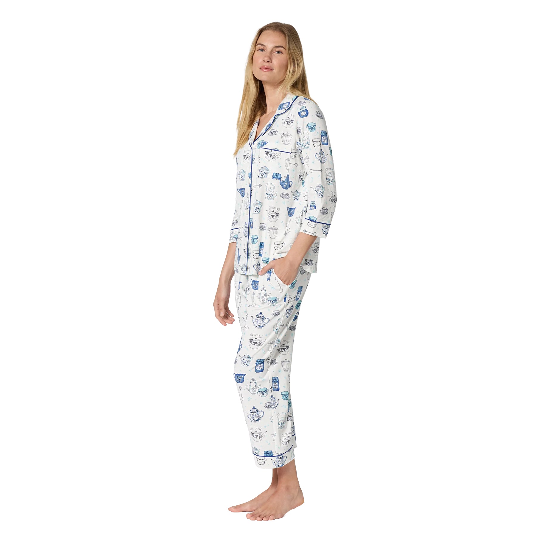 Side view of white BedHead pajama set featuring cropped pants, three-quarter sleeves and an all-over blue tea-themed print.