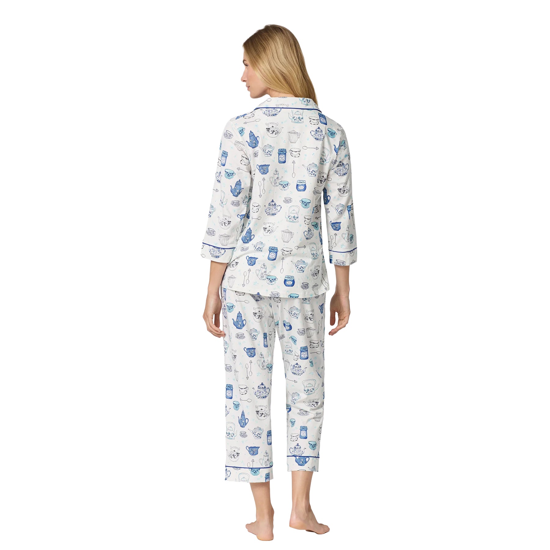 Back view of white BedHead cropped pajama set featuring an all-over blue tea-themed print and contrast piping.