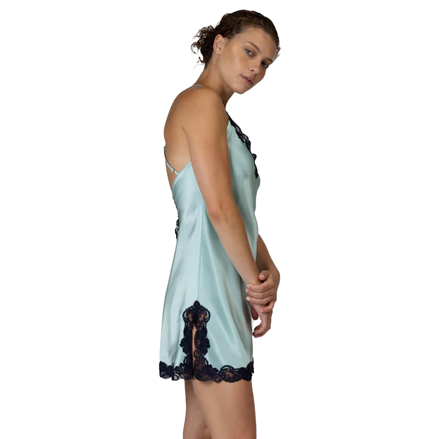 Side view of aquamarine satin nightdress with navy lace accents and a feminine lightweight silhouette.